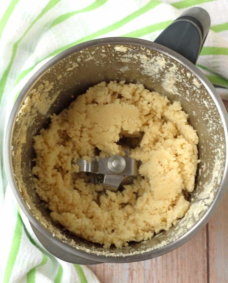 Puréed almonds in blender bowl.
