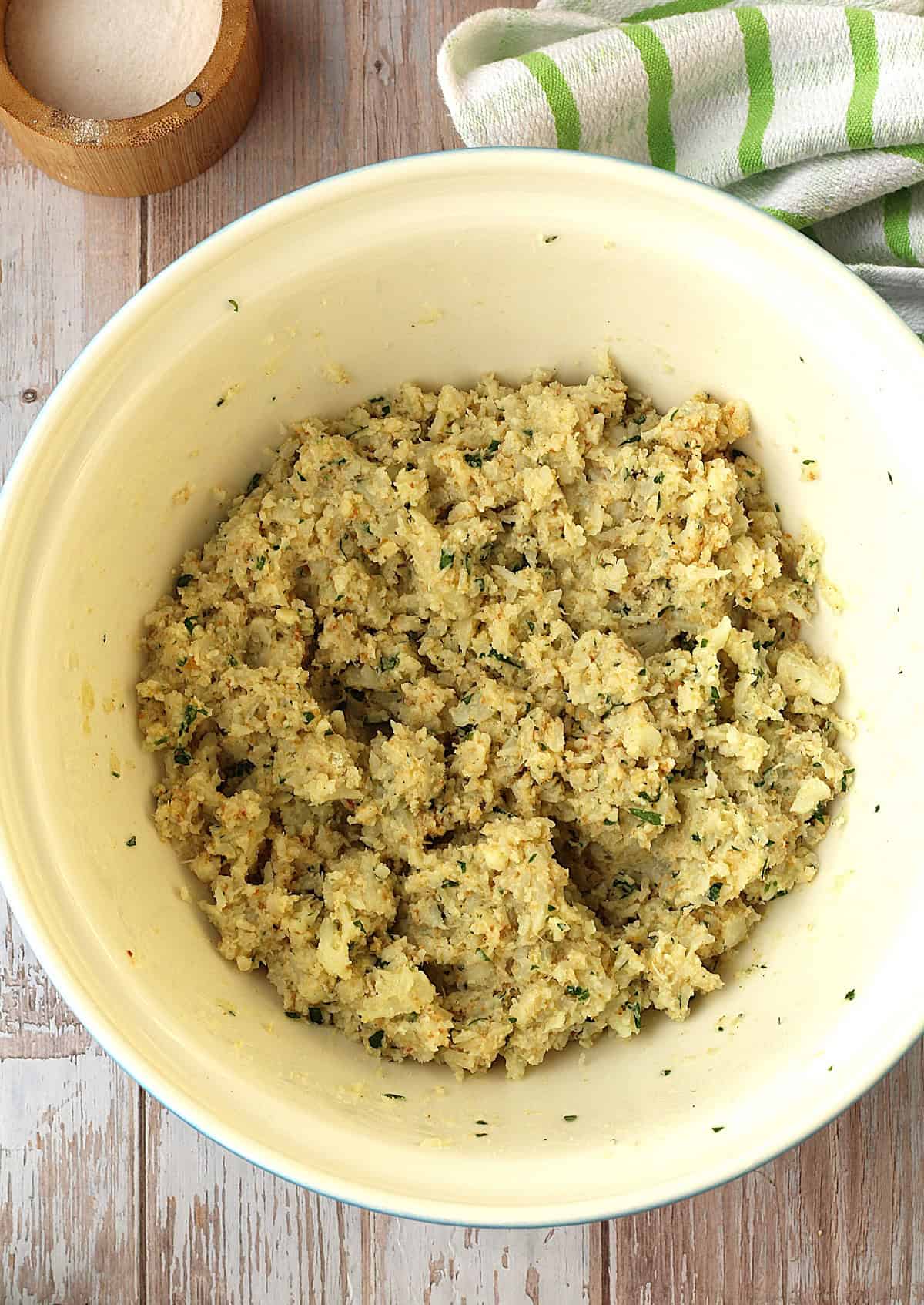 Cauliflower meatballs mixture in large bowl.