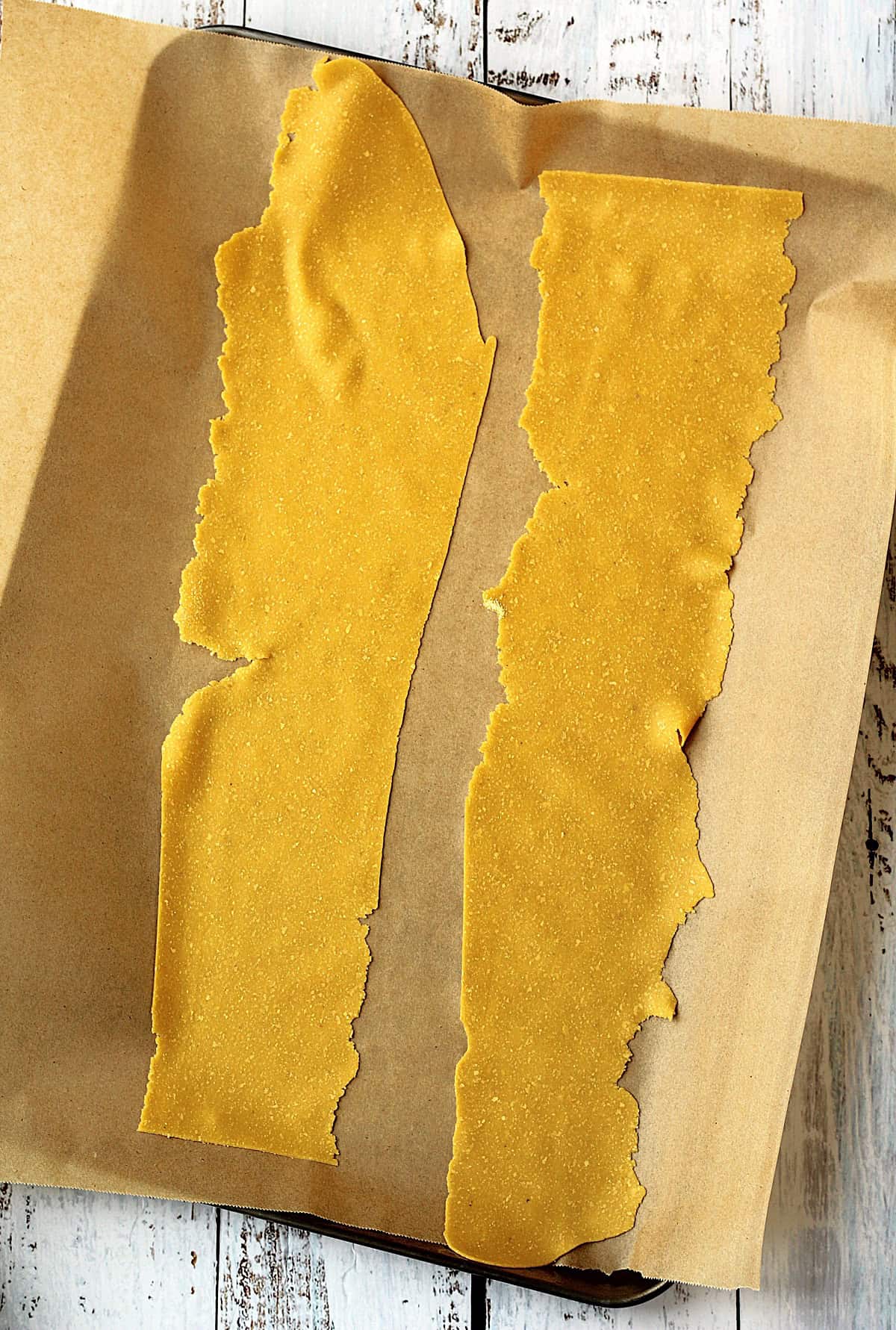 Rolled sheets of chickpea flour pasta dough.