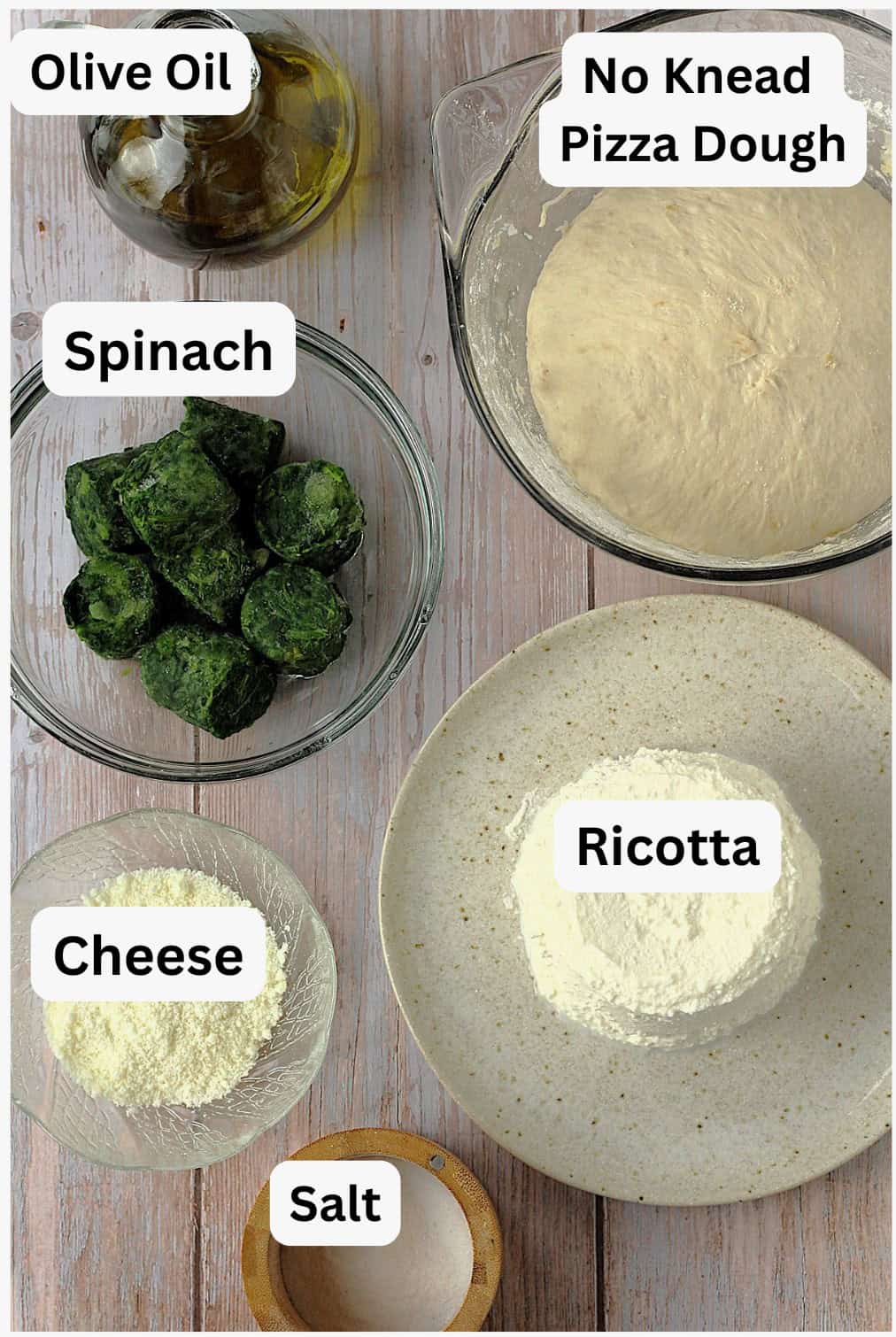 Bowls with pizza dough, ricotta, spinach, cheese salt and olive oil