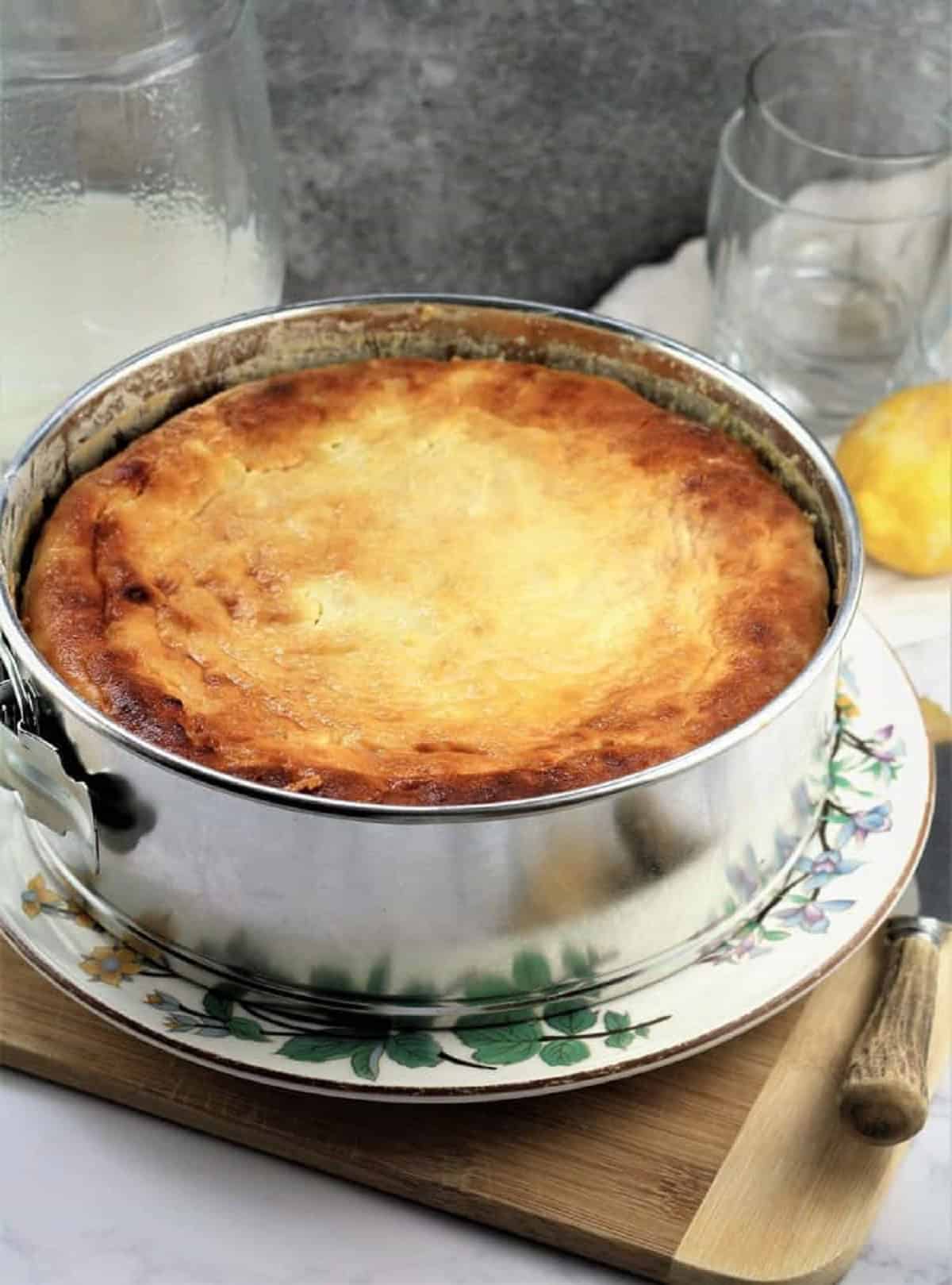 Just baked pastiera in springform pan on plate.