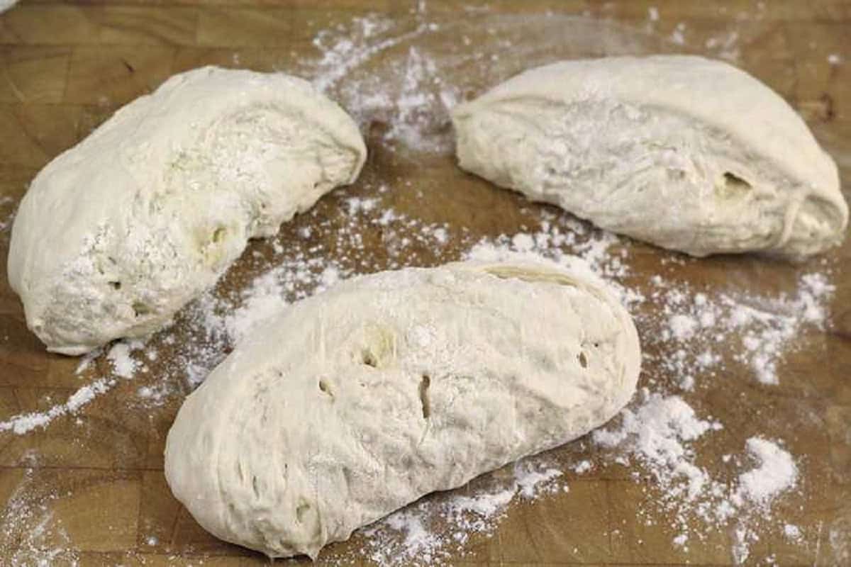 Bread dough divided into 3 pieces.