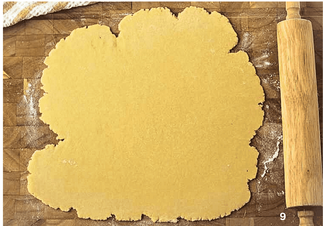 Mom's Sicilian Ricotta Pie Pie dough for ricotta pie rolled out on wood board with rolling pin.