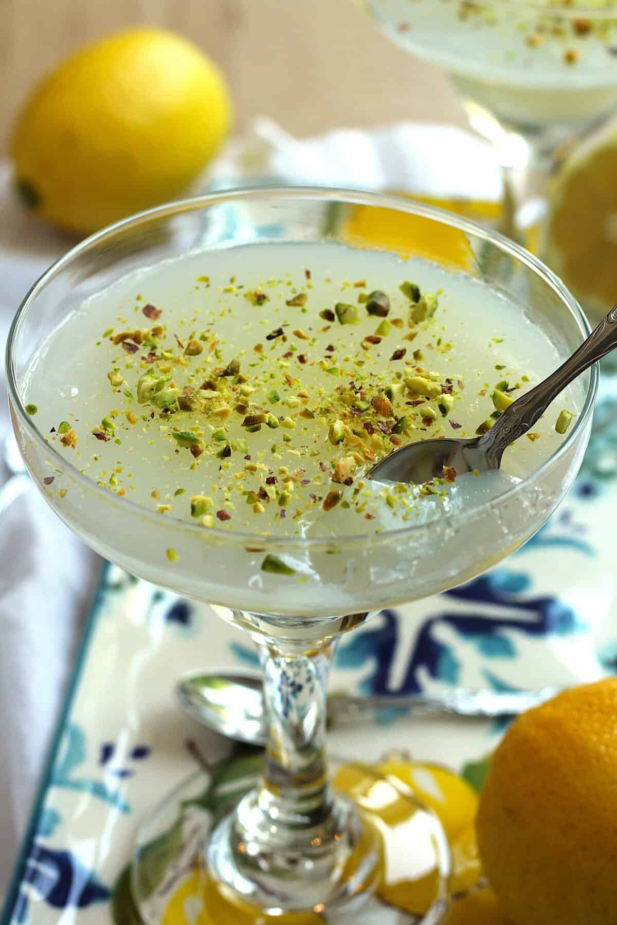 Sicilian gelo di limone in glass with spoon in it.