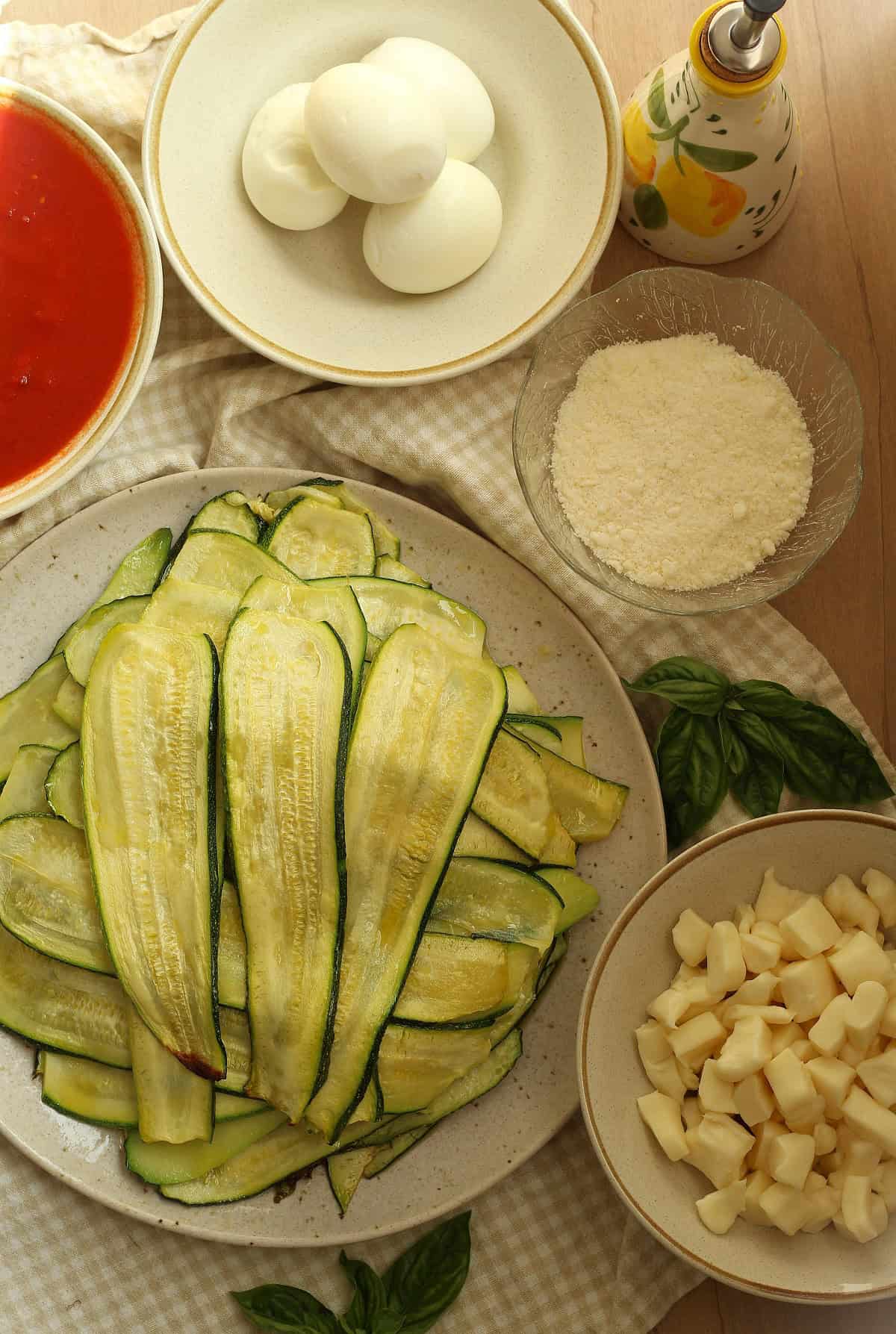 Sliced zucchini, parmigiano, cubed mozzarella, tomato sauce and hard boiled eggs.