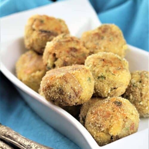 Baked eggplant meatballs piled on plate.