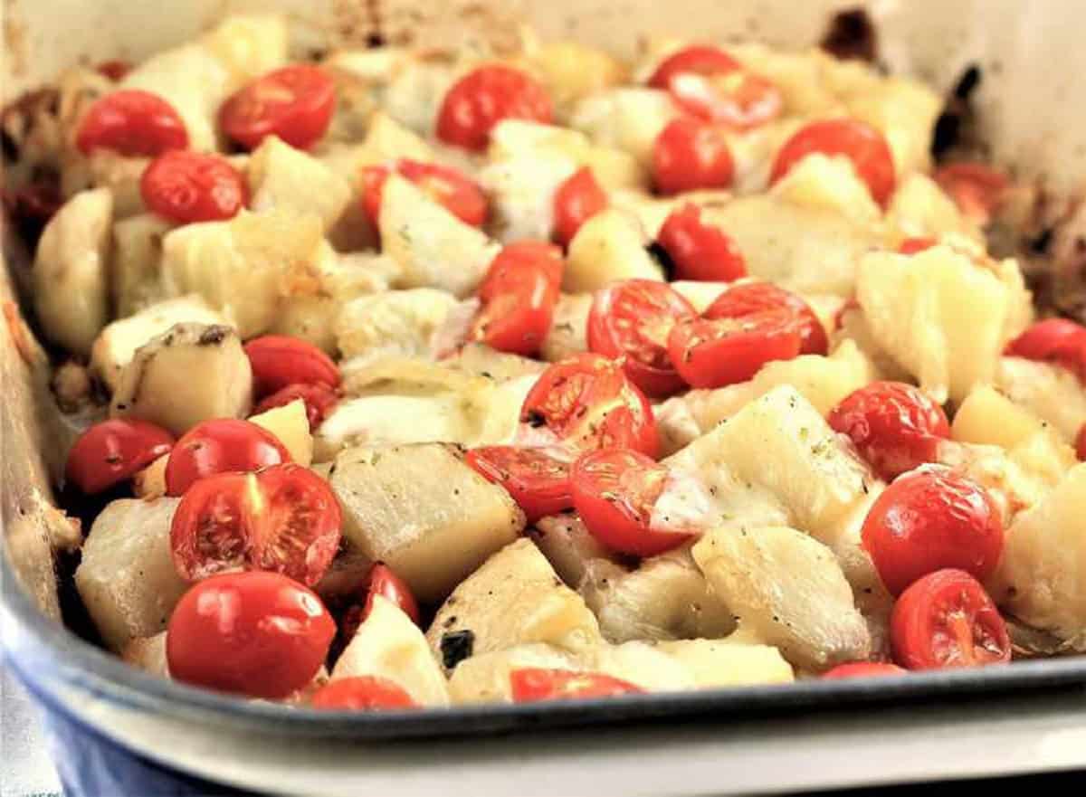 Baked potatoes with mozzarella and tomatoes.