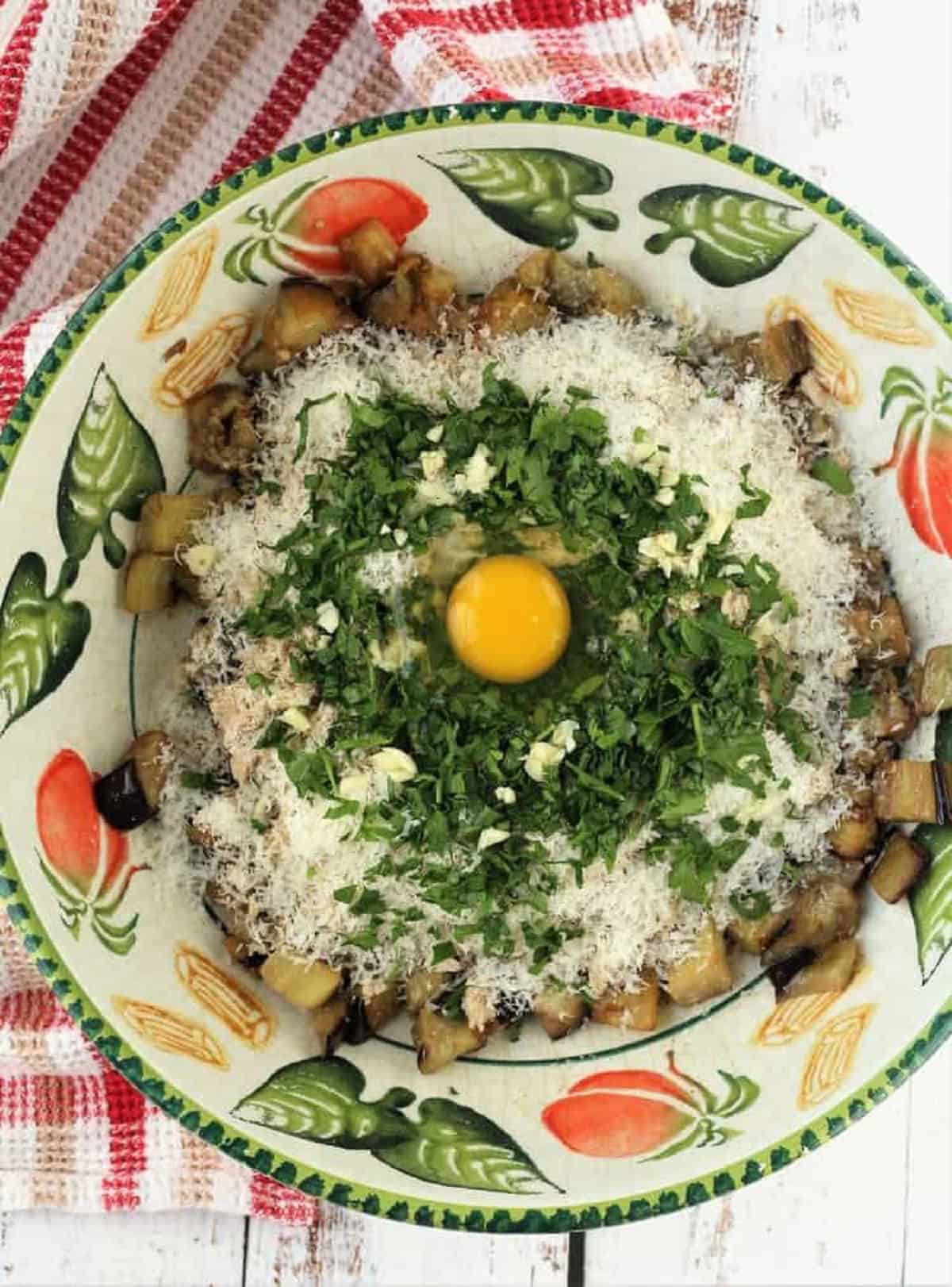Eggplant meatball ingredients in bowl.