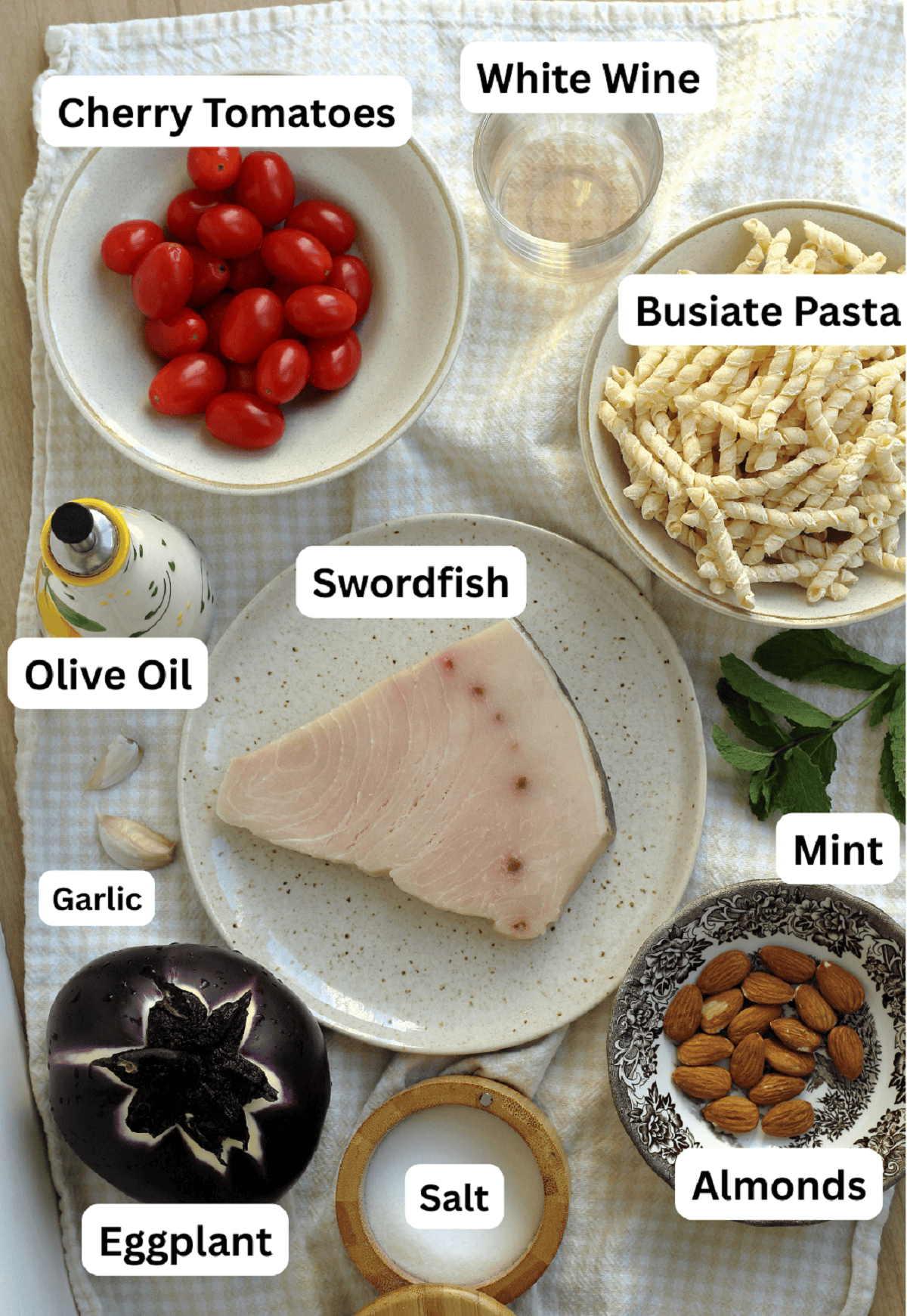 Swordfish, pasta, mint, almonds, salt, eggplant, garlic, olive oil, tomatoes and white wine.