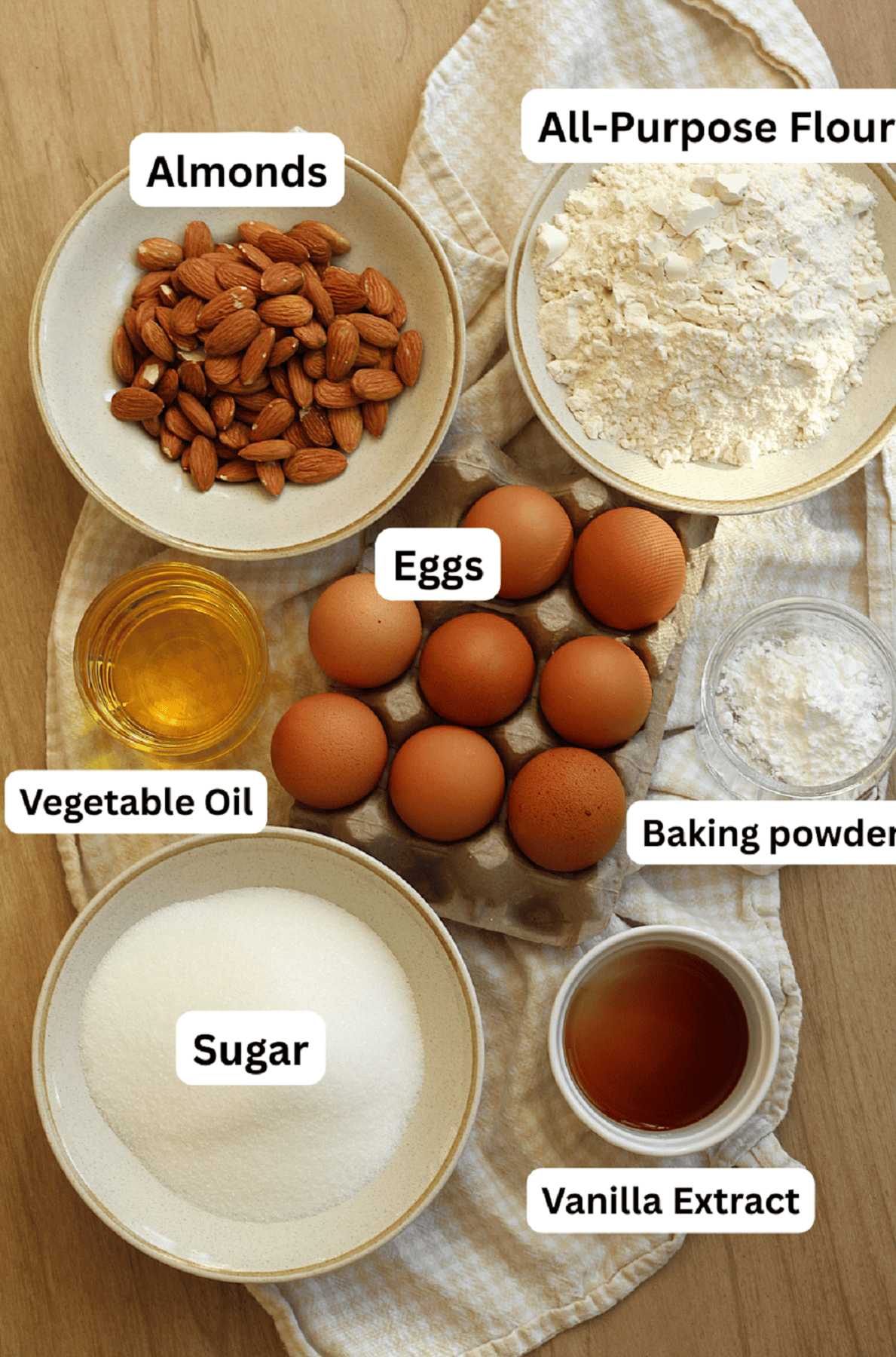 Flour, baking powder, vanilla, sugar, eggs, oil and almonds.