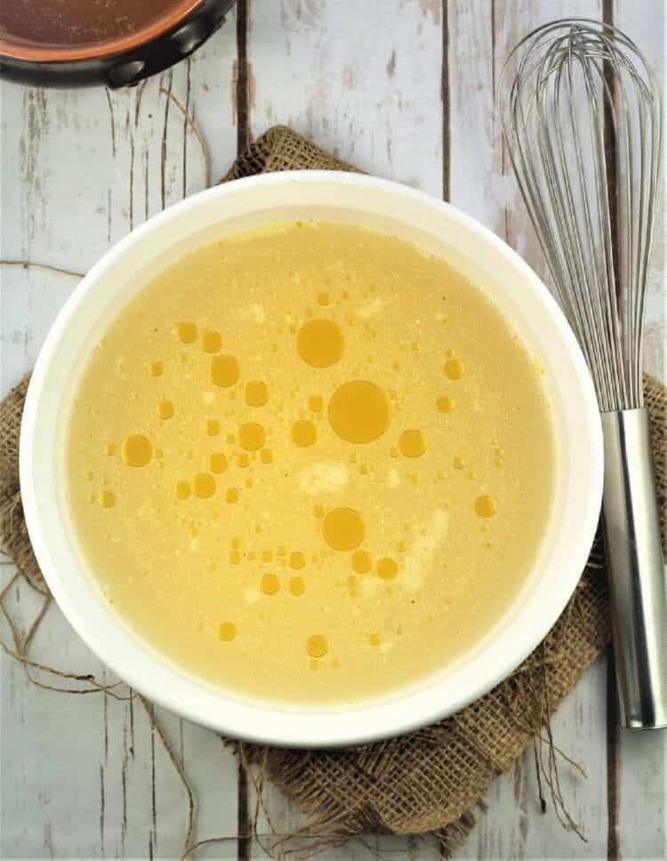 Cornmeal flour stirred into water with olive oil in casserole dish.