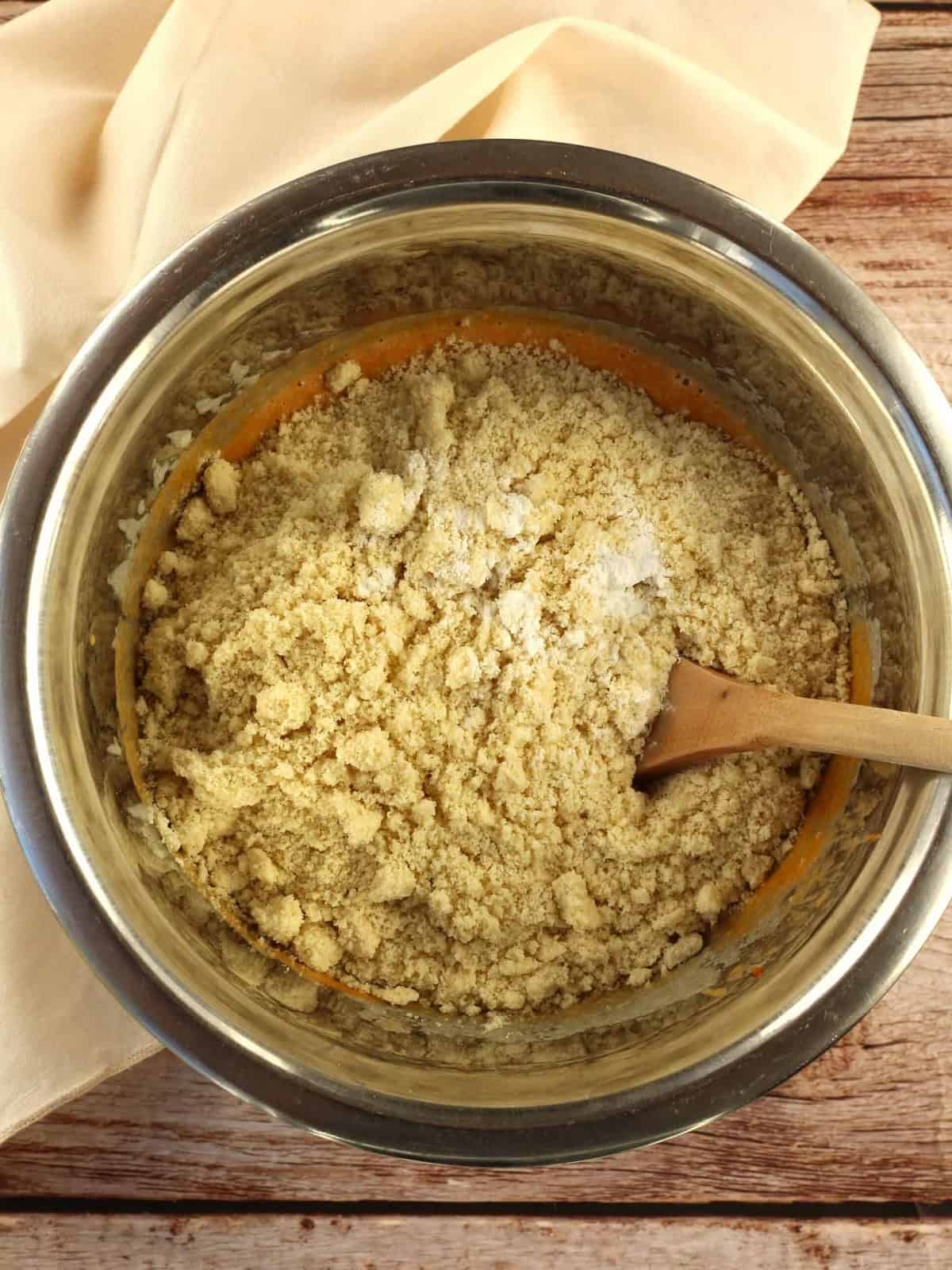 Almond flour added to bowl with pumpkin purée, egg, sugar and oil.