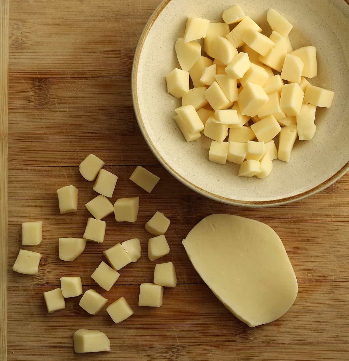 Mozzarella cut into cubes for patate pizzaiola recipe.