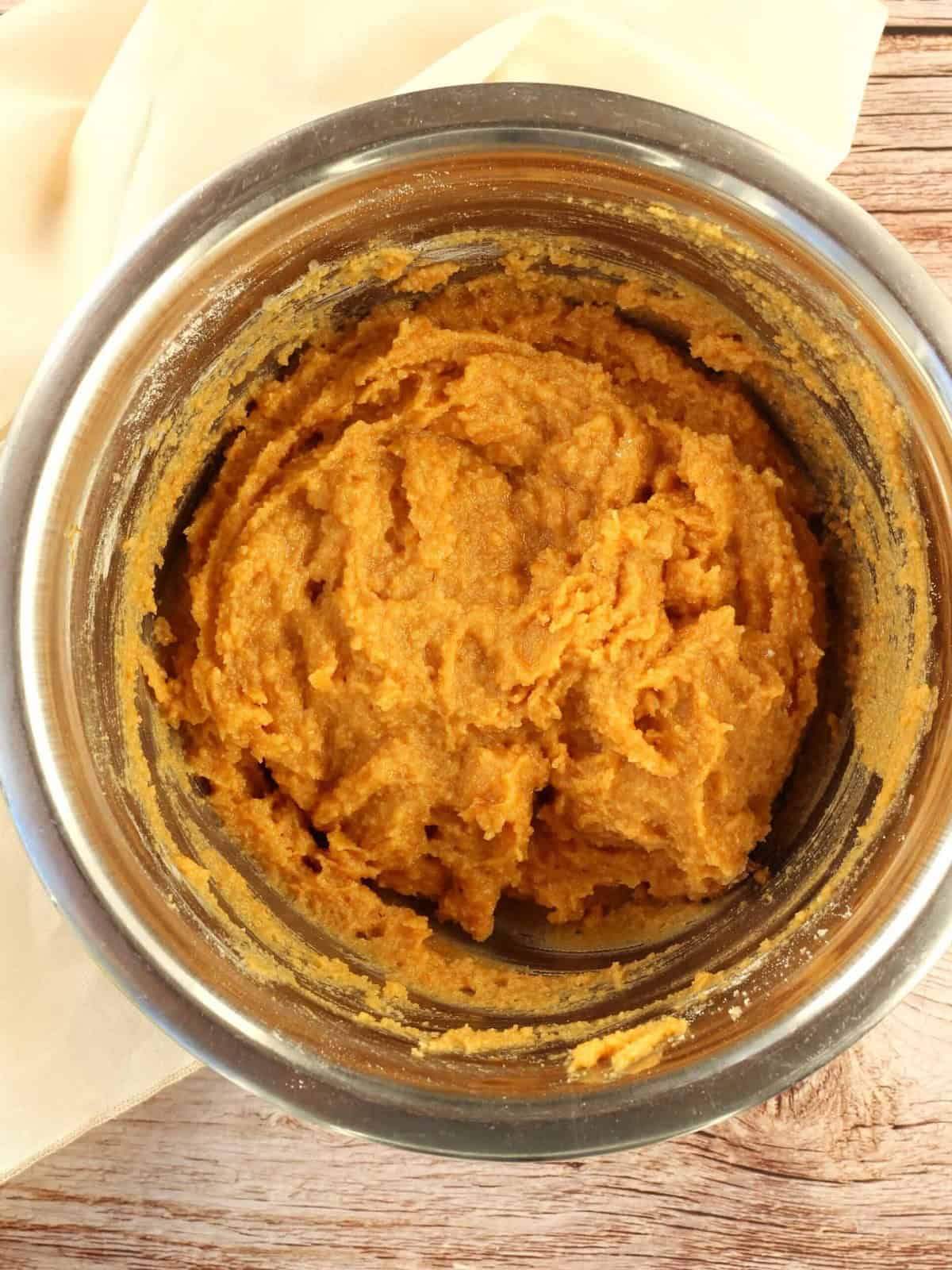 Pumpkin almond flour cookie dough in bowl.