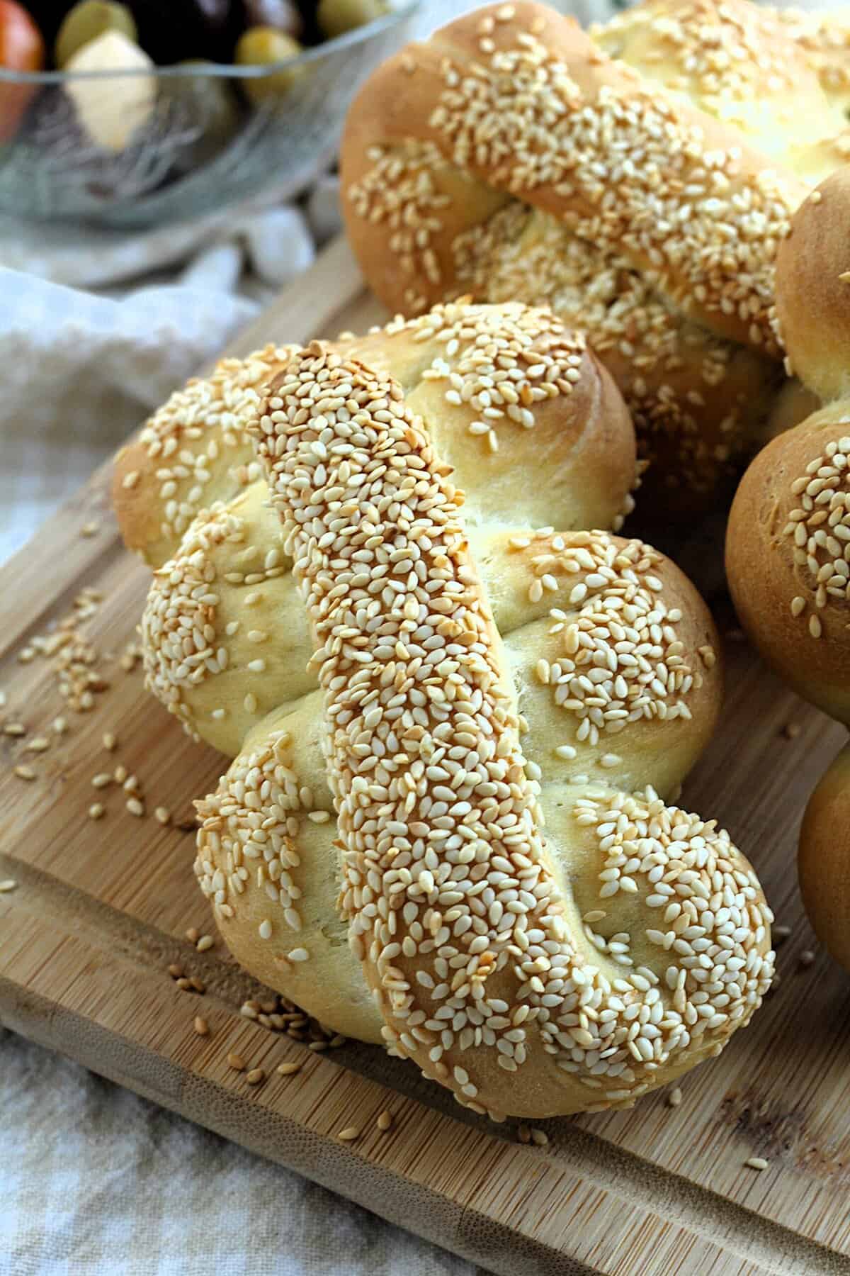 Sicilian semolina bread withe sesame seeds on wood board.