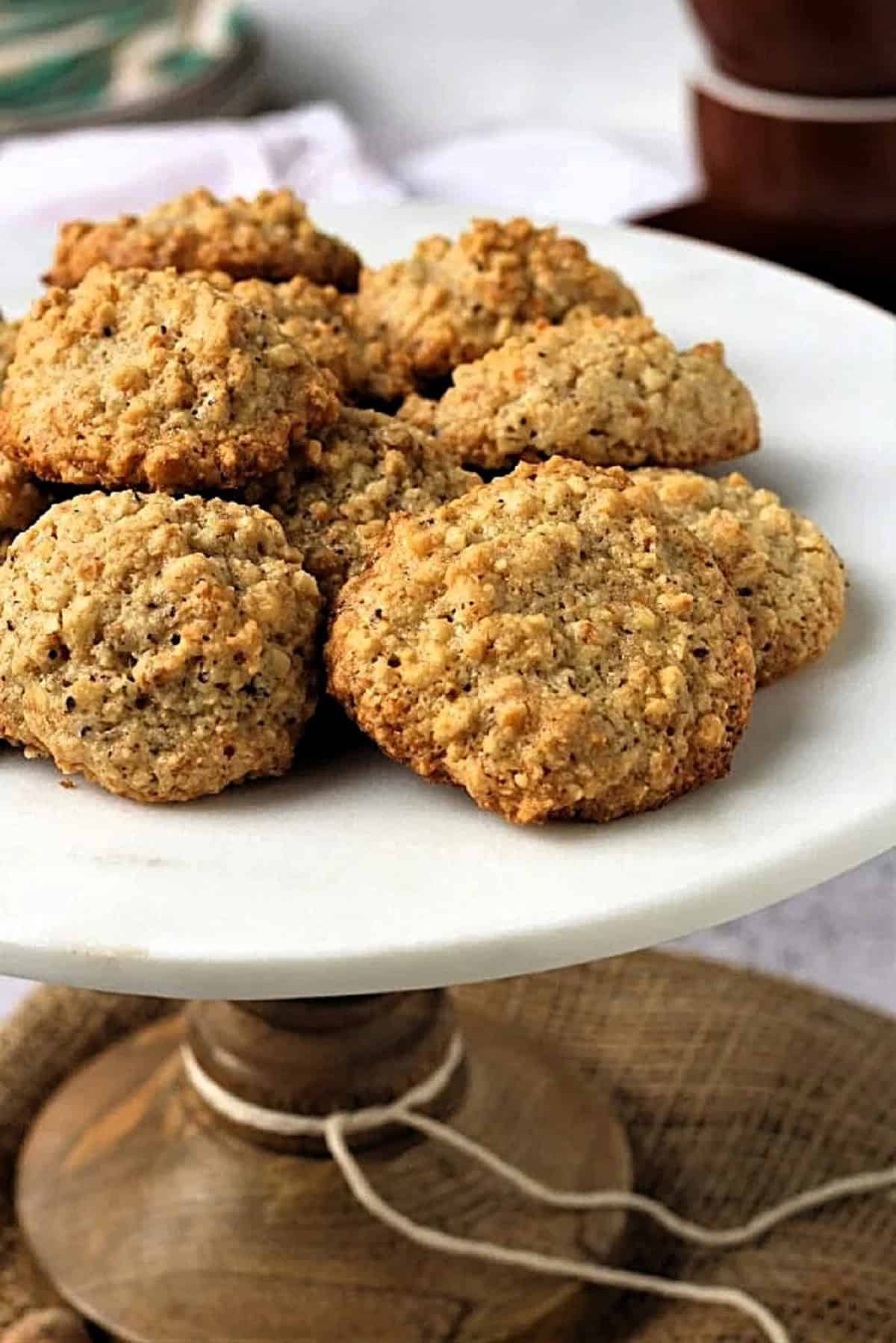 3-ingredient hazelnut cookies piled on cookie stand.