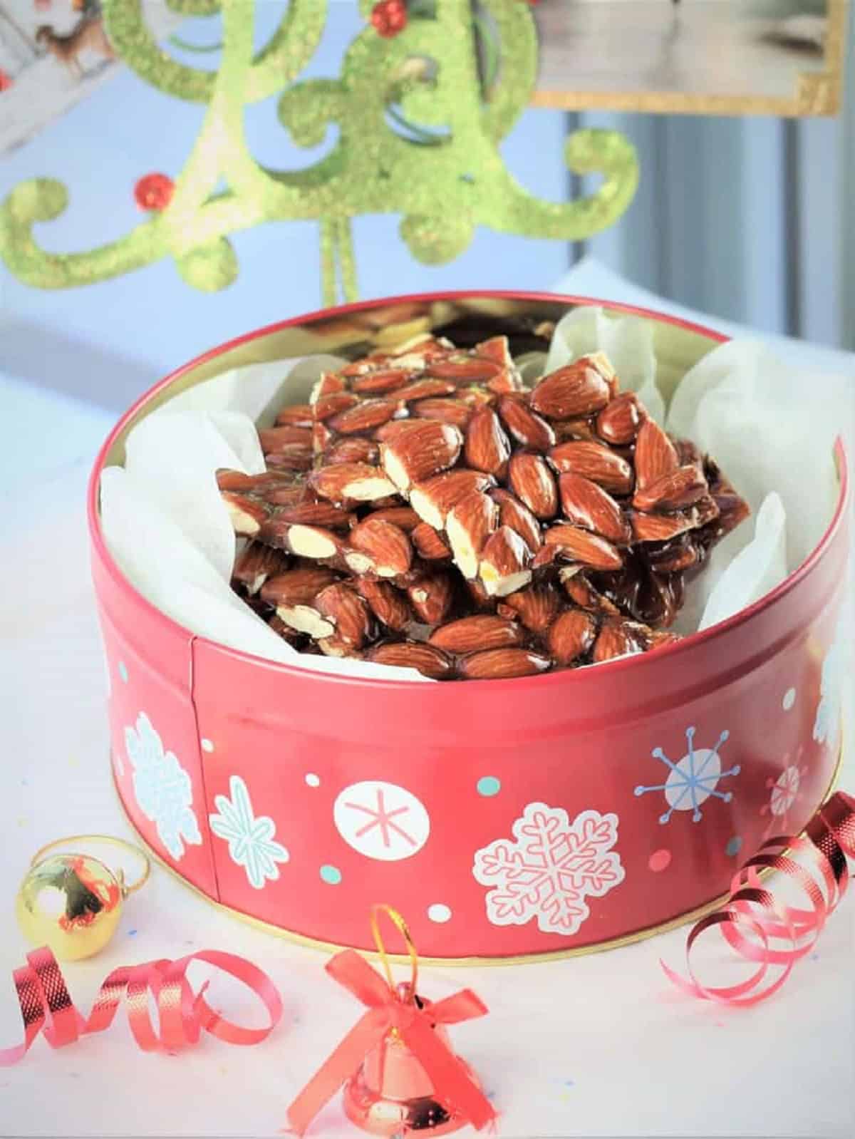 Sicilian almond brittle in decorative tin container.