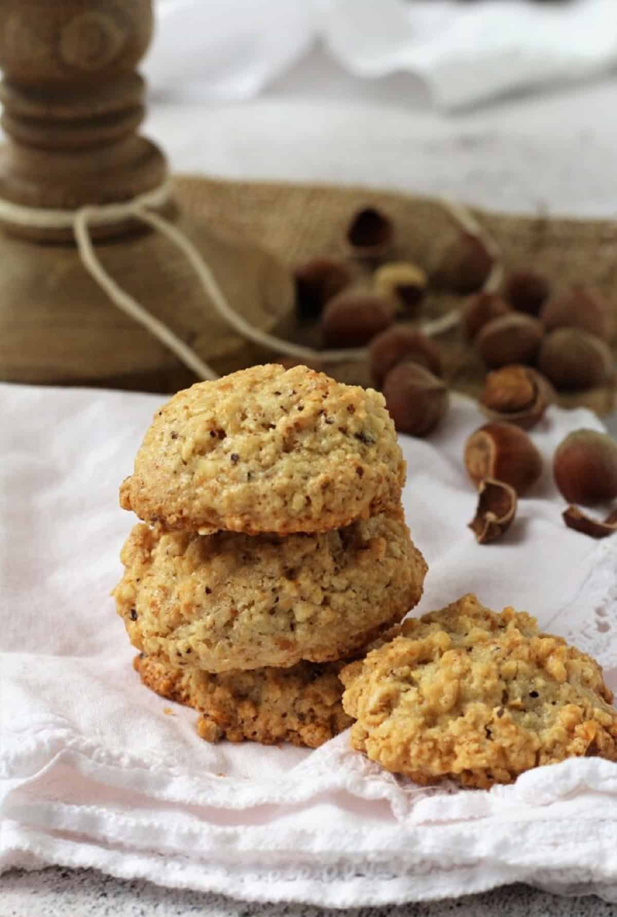 Italian hazelnut cookies piled on one another.