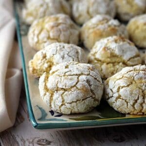 Soft and chewy lemon almond cookies on serving plate.