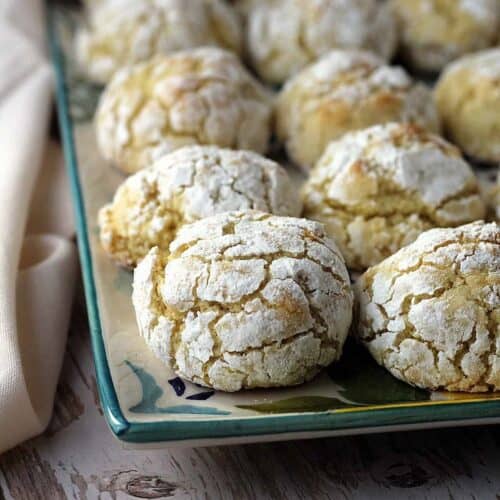 Soft and chewy lemon almond cookies on serving plate.