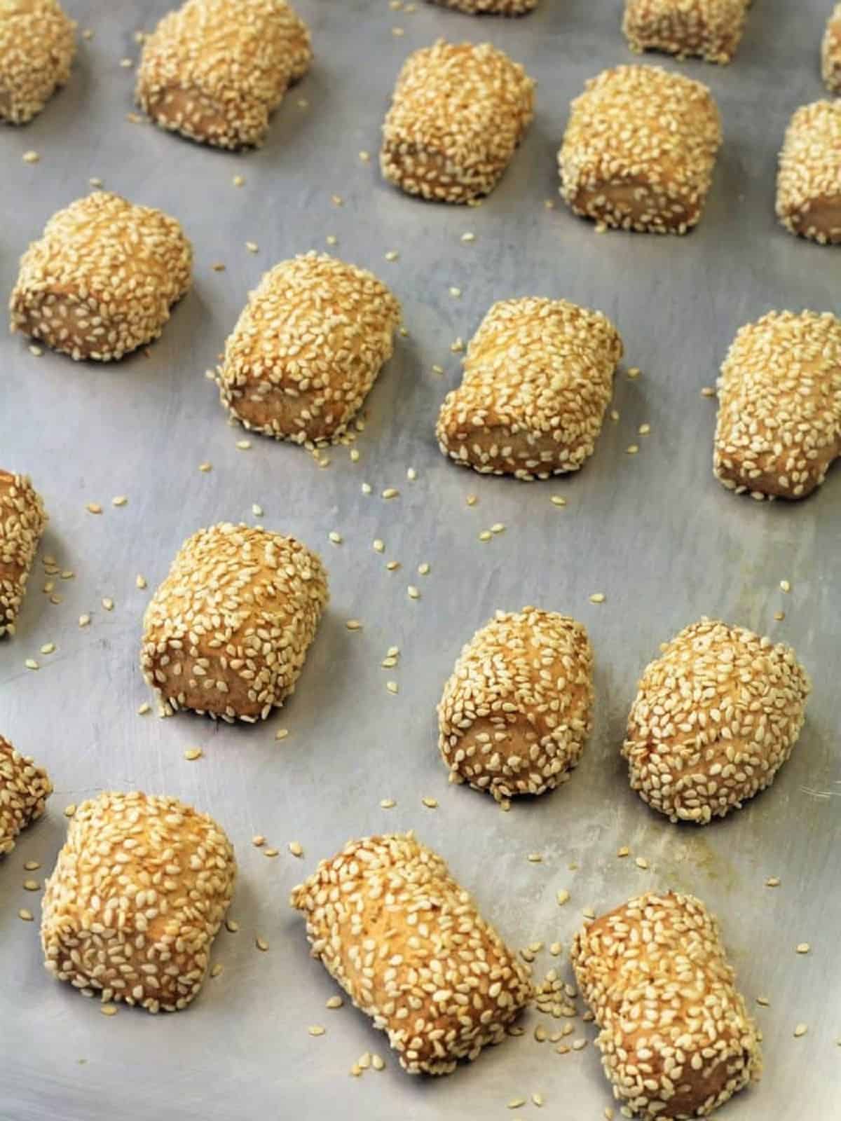Biscotti regina - Sicilian-sesame seed-cookies- on baking sheet.