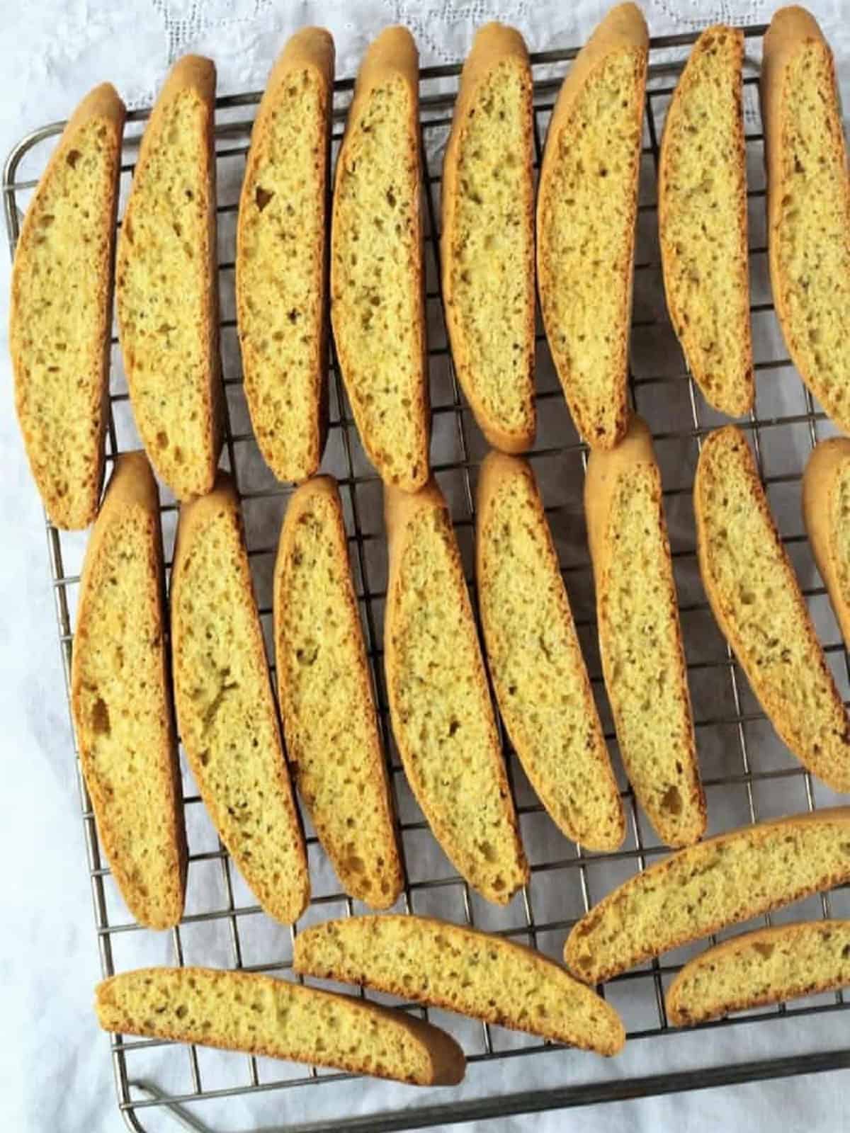 Biscotti with anise seed on wire cooling rack.