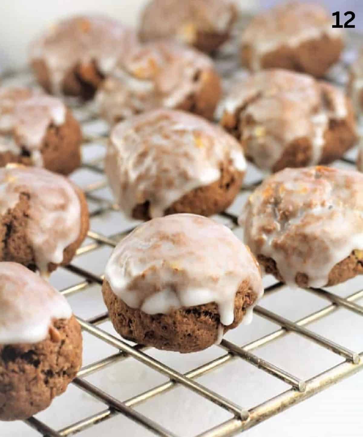 Tetù (Sicilian Chocolate Spice Cookies) Glazed tetù cookies on wire rack.