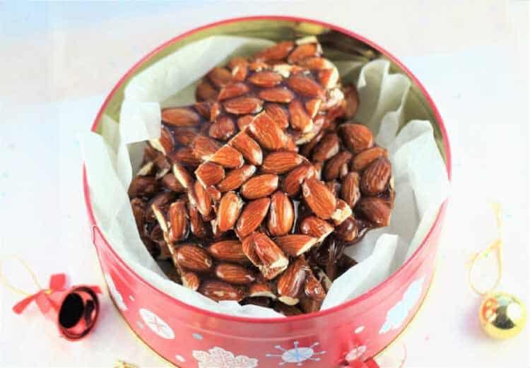 Sicilian almond brittle pieces in decorative tin.