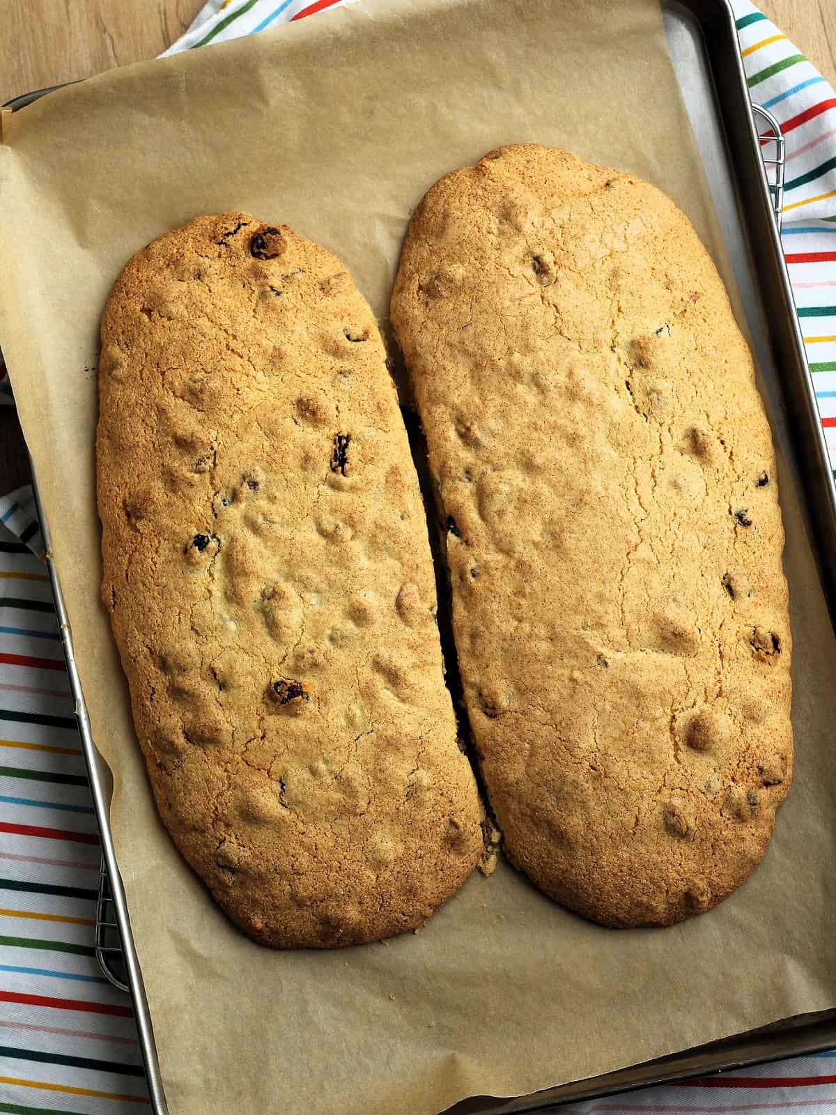 Just baked loaves of cornmeal pistachio cranberry biscotti on baking sheet.