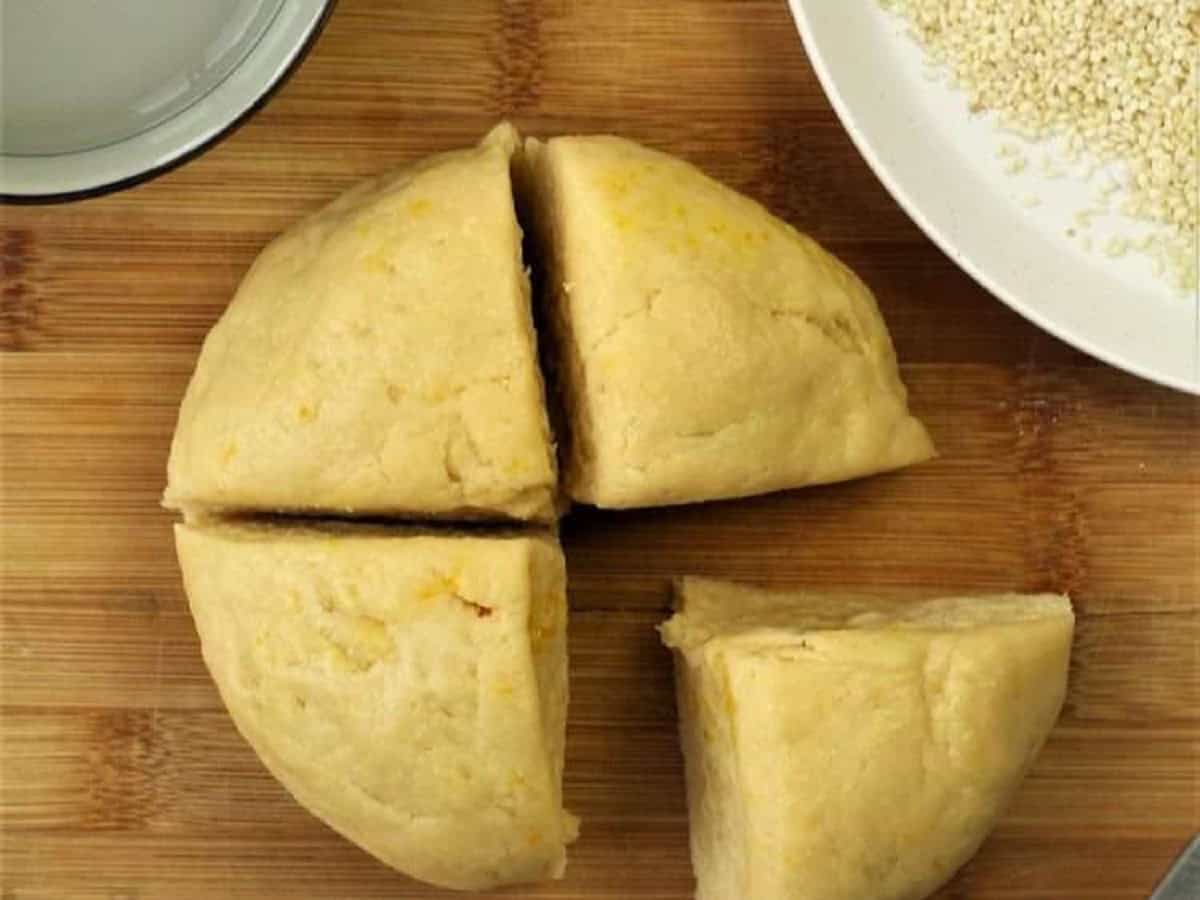 Biscotti regina dough divided into 4 pieces.