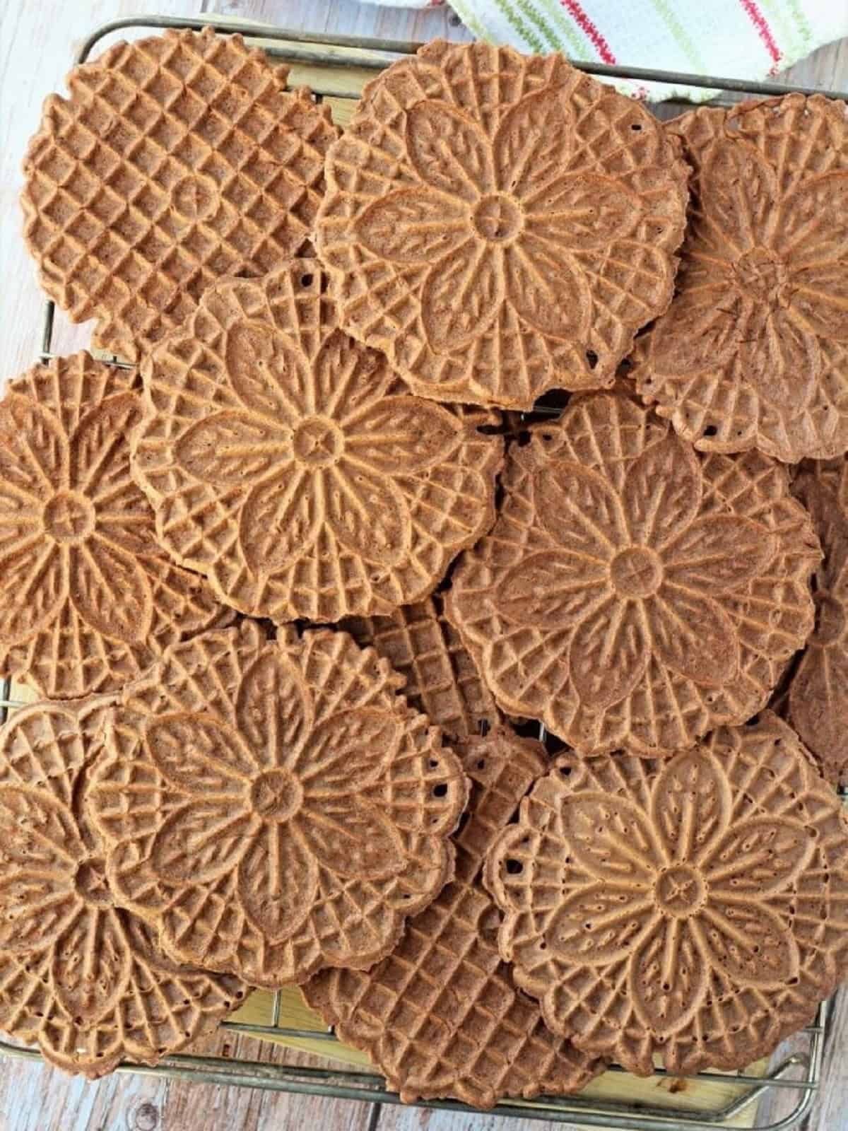 Chocolate waffle cookies on wire cooling rack.