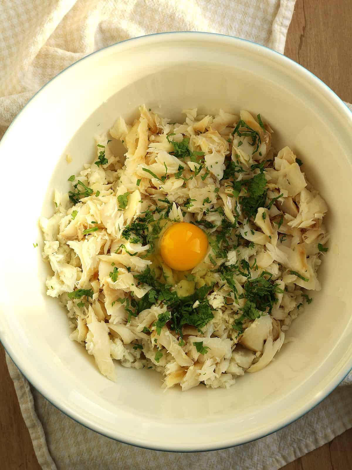 Salt cod and potato croquettes mixture in large bowl