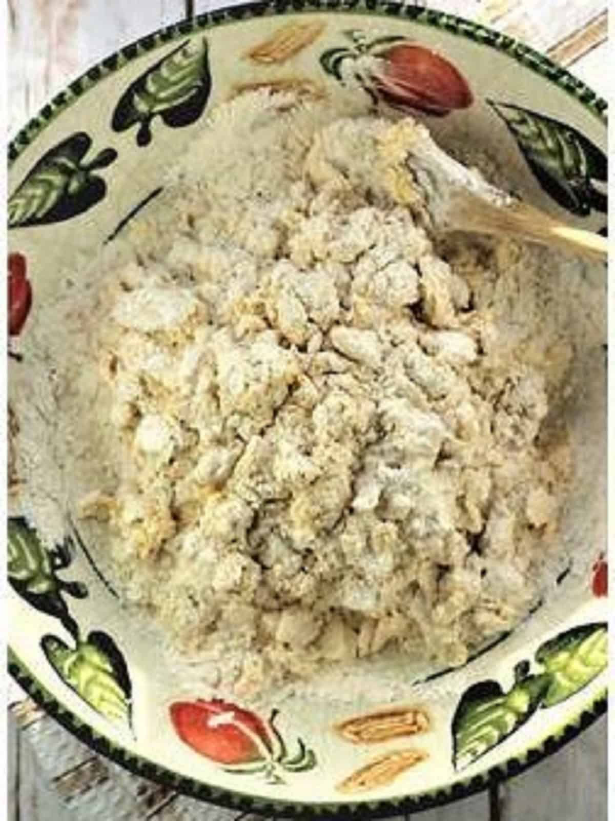Rough chiacchiere dough in large bowl.