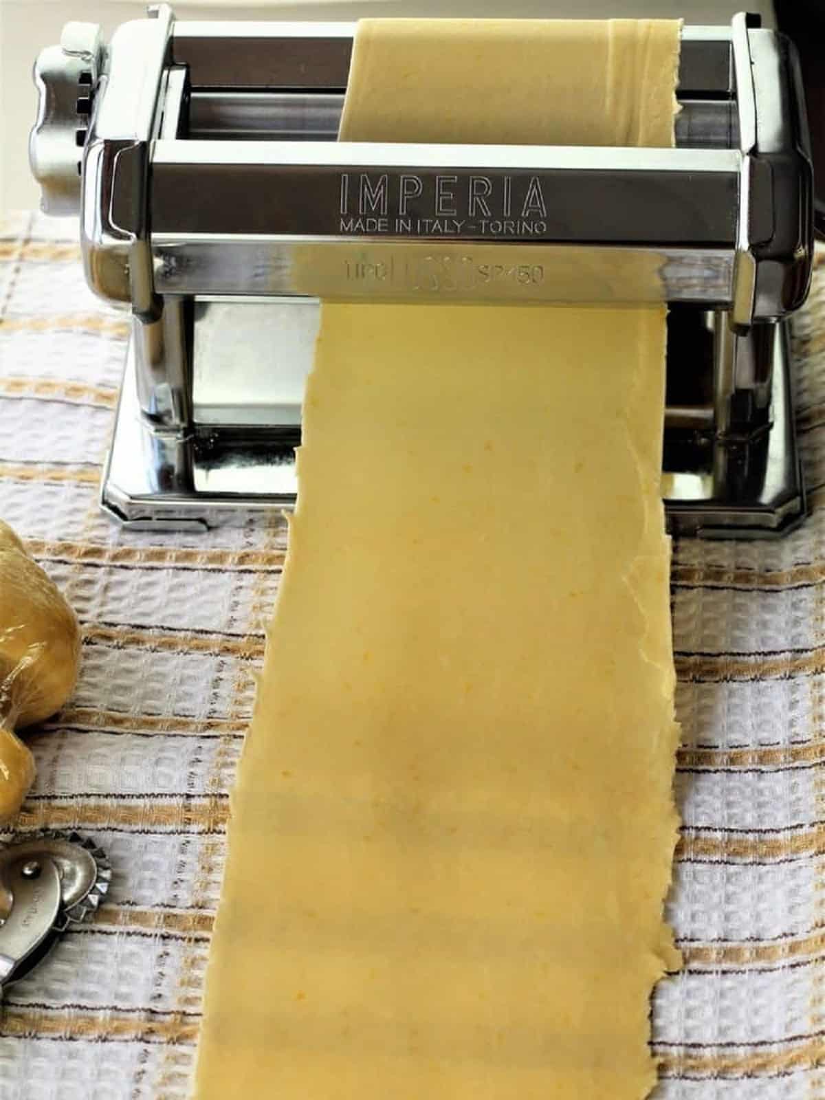 Chiacchiere dough rolled with pasta maker.