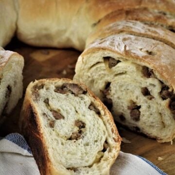 Sicilian sausage bread cut into wedges.