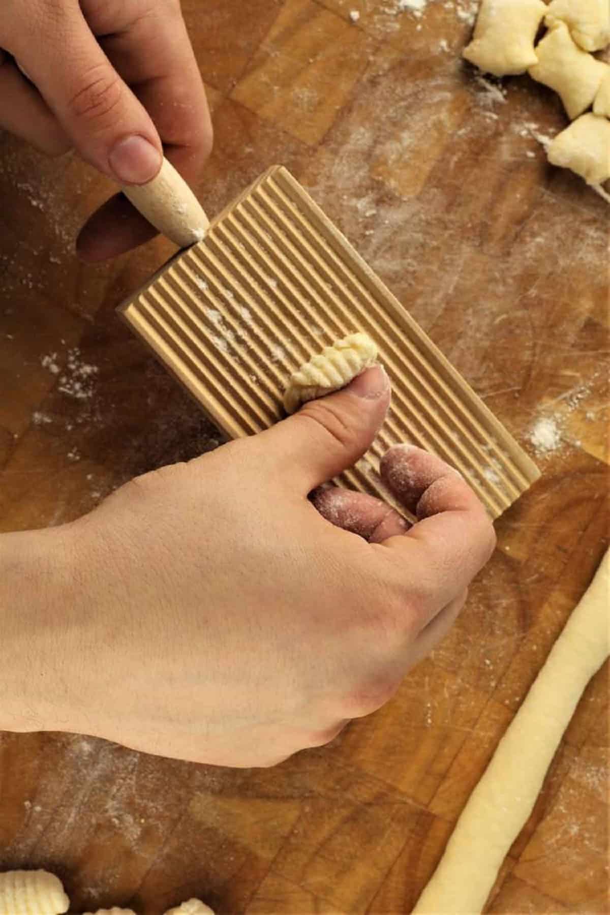 How to shape gnocchi on a wood gnocchi board.