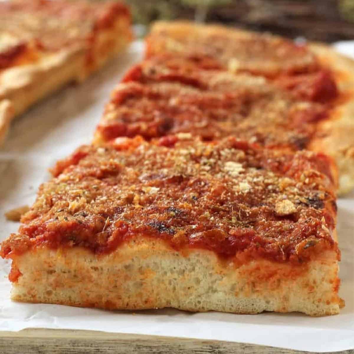 Sicilian sfincione pizza cut into squares.
