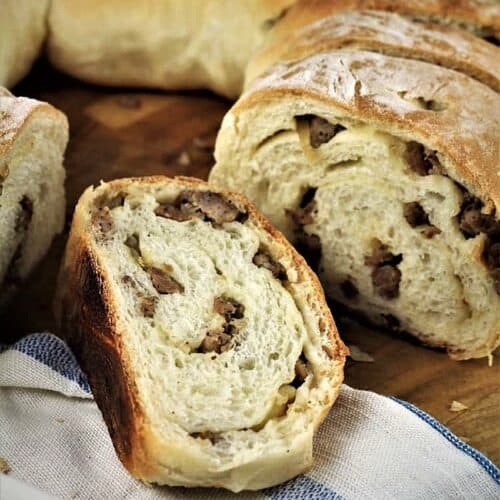 Sausage bread cut into wedges.