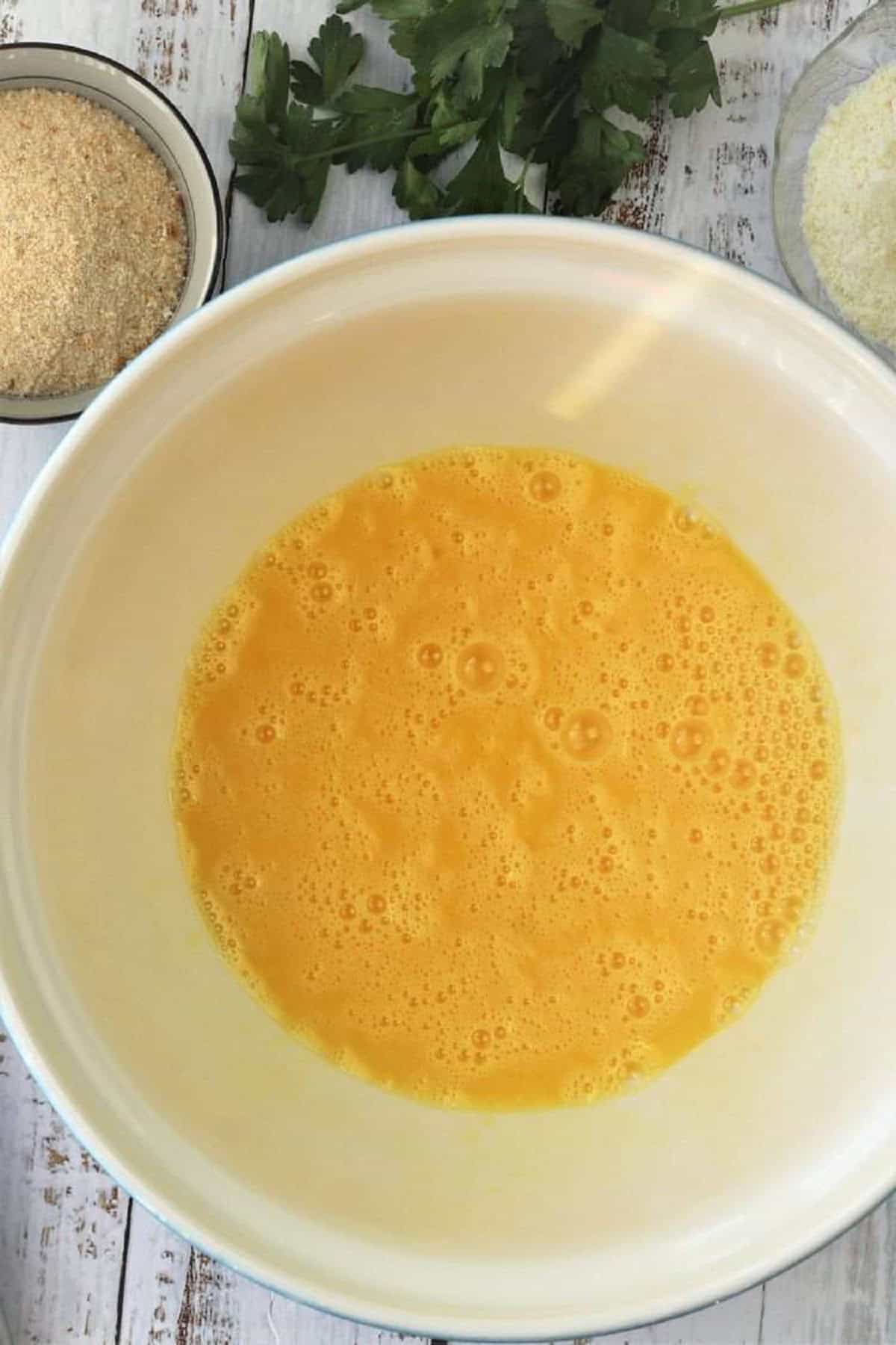 Beaten eggs in large bowl for zuppa imperiale recipe.