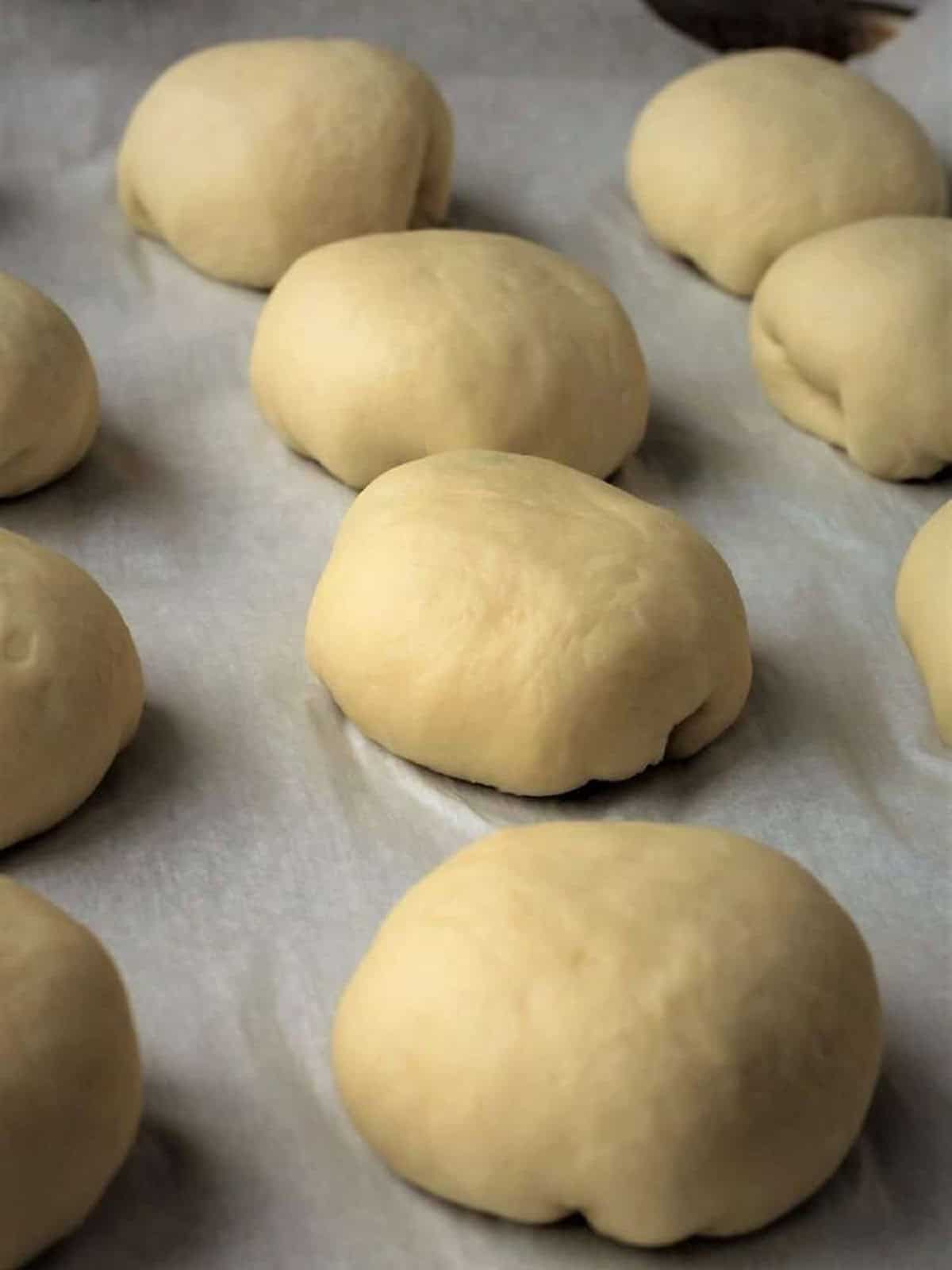 Sicilian iris filled with ricotta on baking sheet.