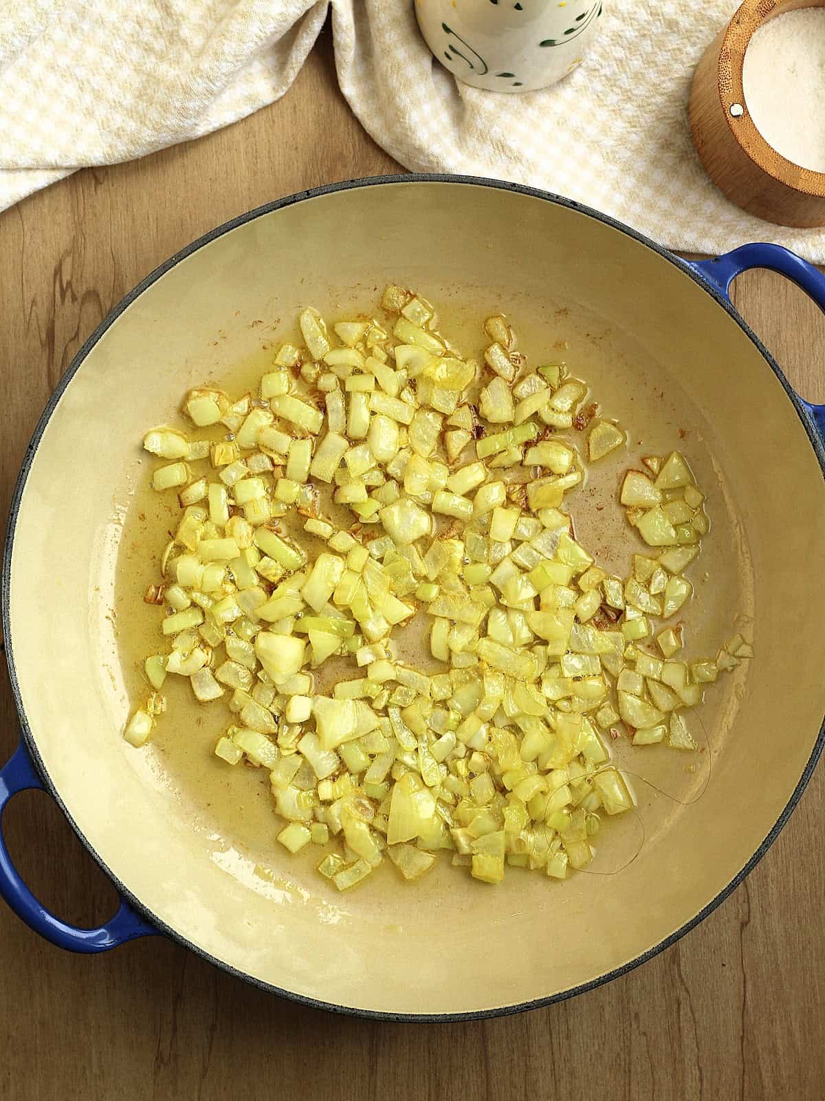 Sautéed onion in sauce pan for zucchini risotto.