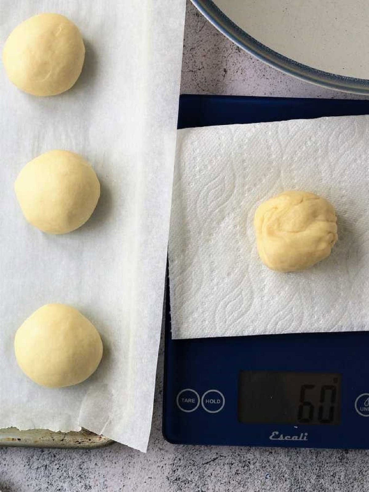 Iris dough divided into balls with kitchen scale.