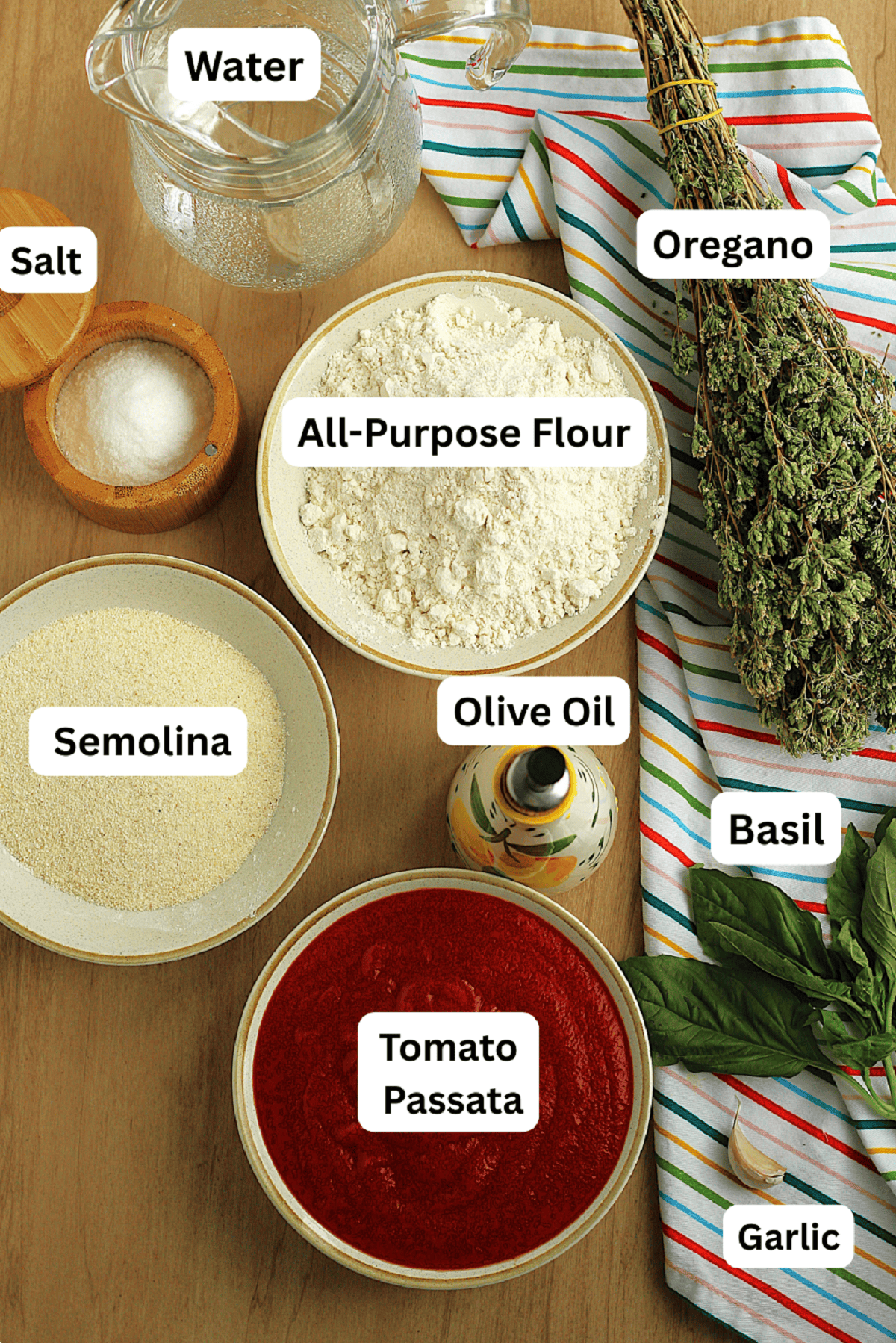 Flour, semolina, tomato passata, oregano, basil, garlic, salt, olive oil and water.