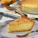 Slice of Sicilian ricotta pie on plate with fork.