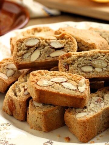 Plate filled with quaresimali lenten almond biscuits.