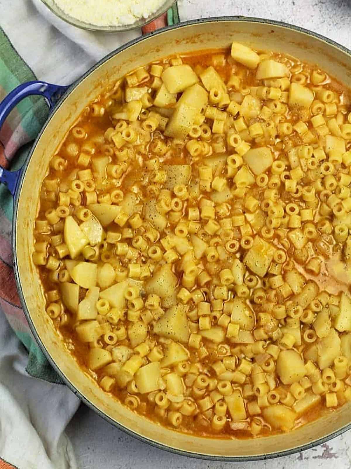Pasta e patate soup in large pan.