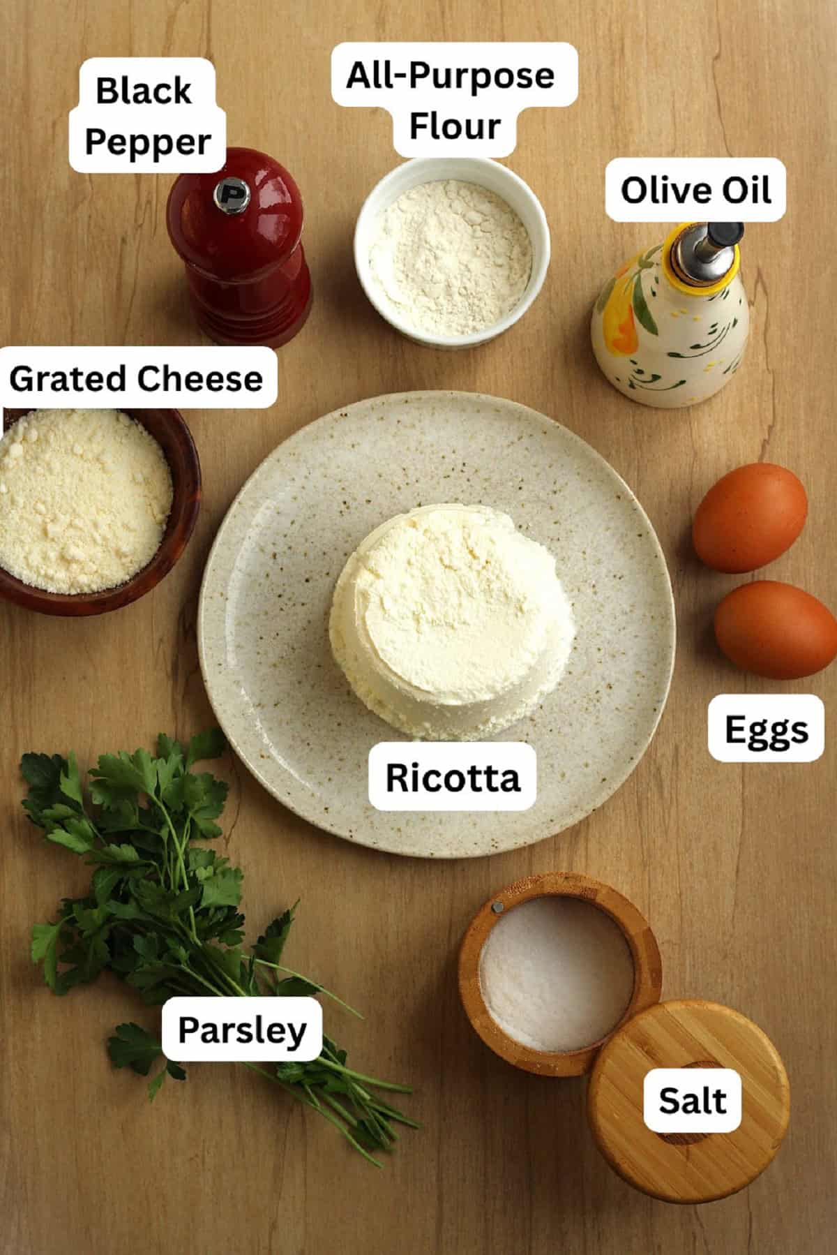 Ricotta, grated cheese, flour, oil, eggs, salt, pepper, and parsley.
