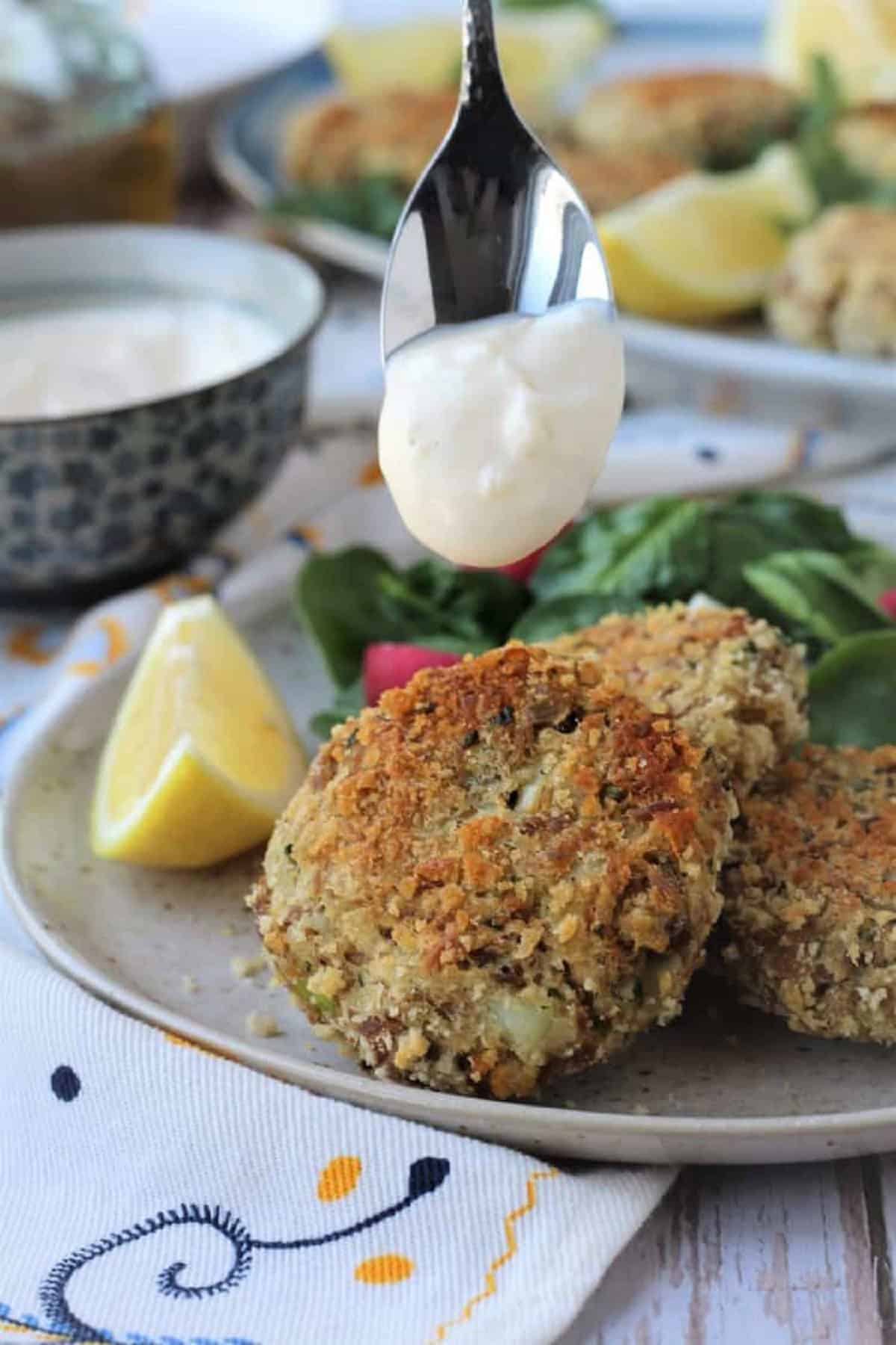 Tuna potato patty topped with a spoonful of garlic aioli.