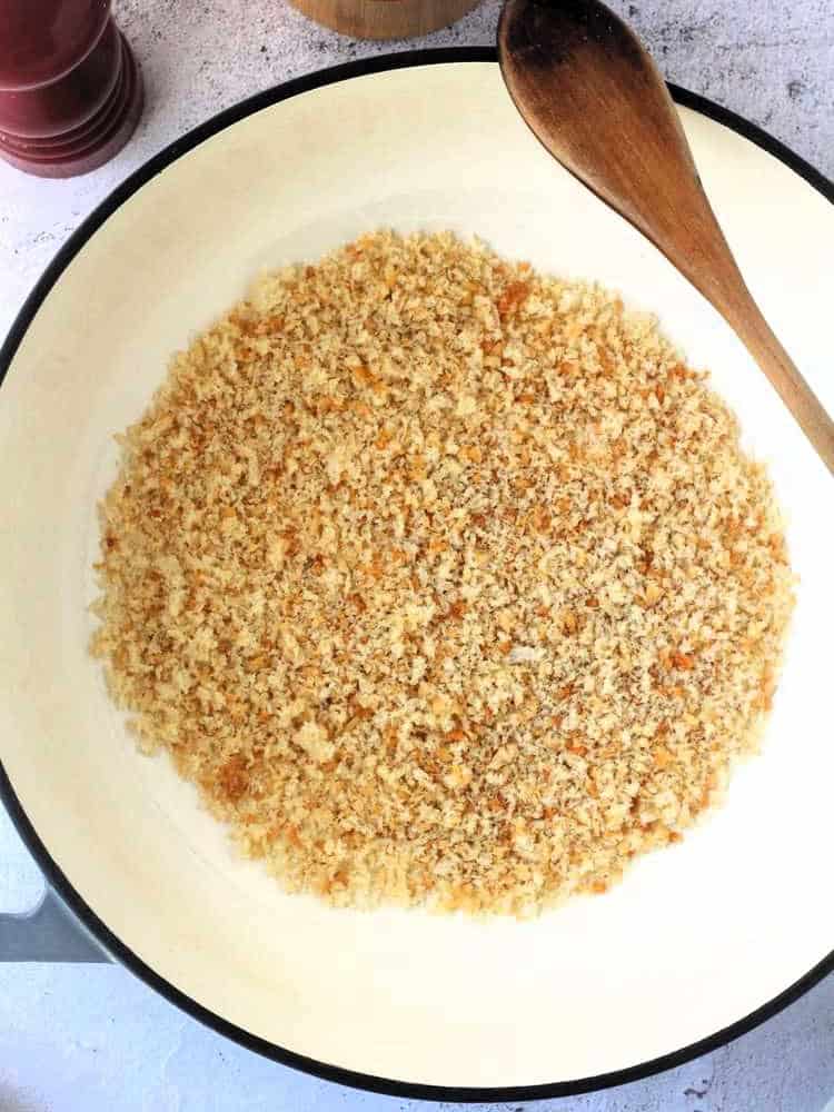 Breadcrumbs in skillet for pasta with anchovies recipe.