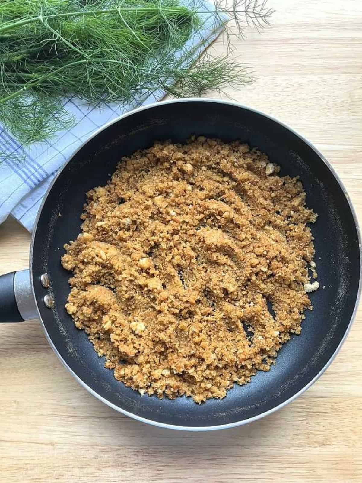 Sicilian breadcrumbs (muddica) toasted in pan.